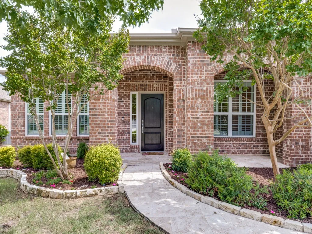 Travertine Walk way and porch are stunning features of this beautiful home.