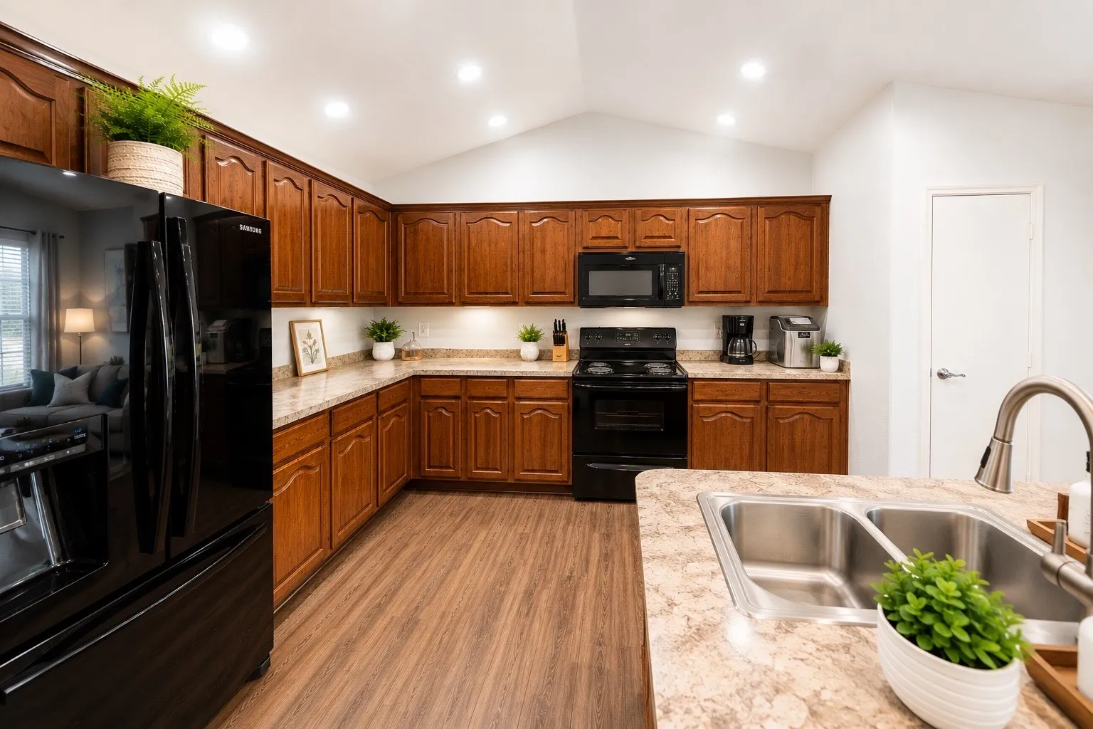 Kitchen featuring wood-finish cabinetry and a complementary L-shaped countertop