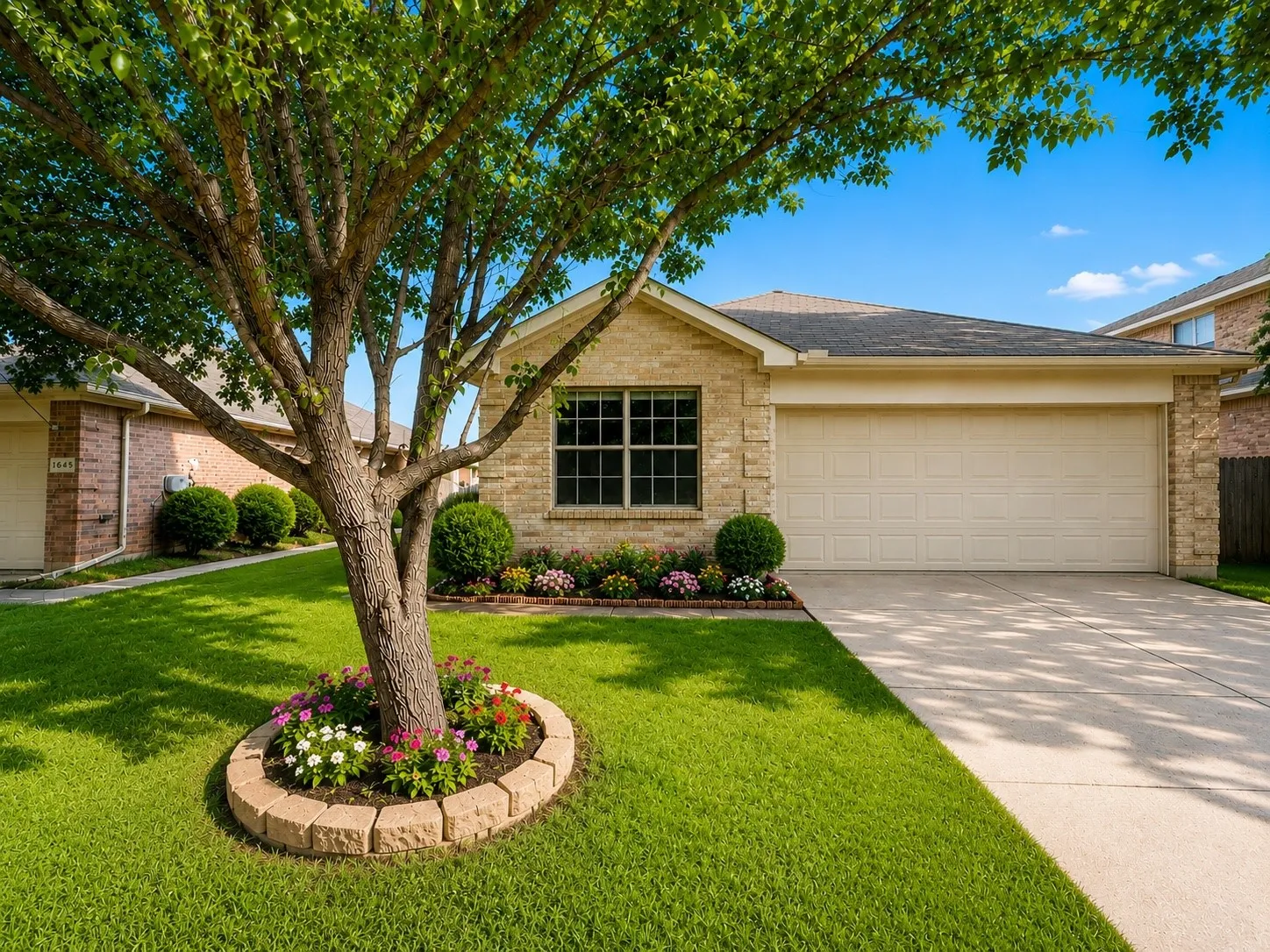 Light brick exterior with an attached garage