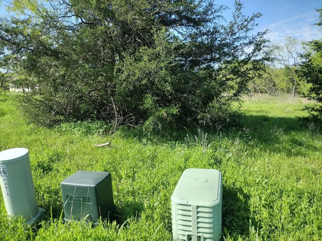 front right hand corner. The dark green box is the center line of the property and runs down the left side over the damn