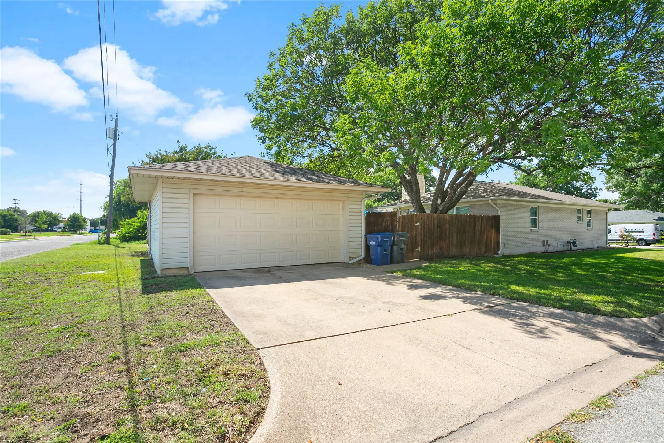 Garage in back/faces side.