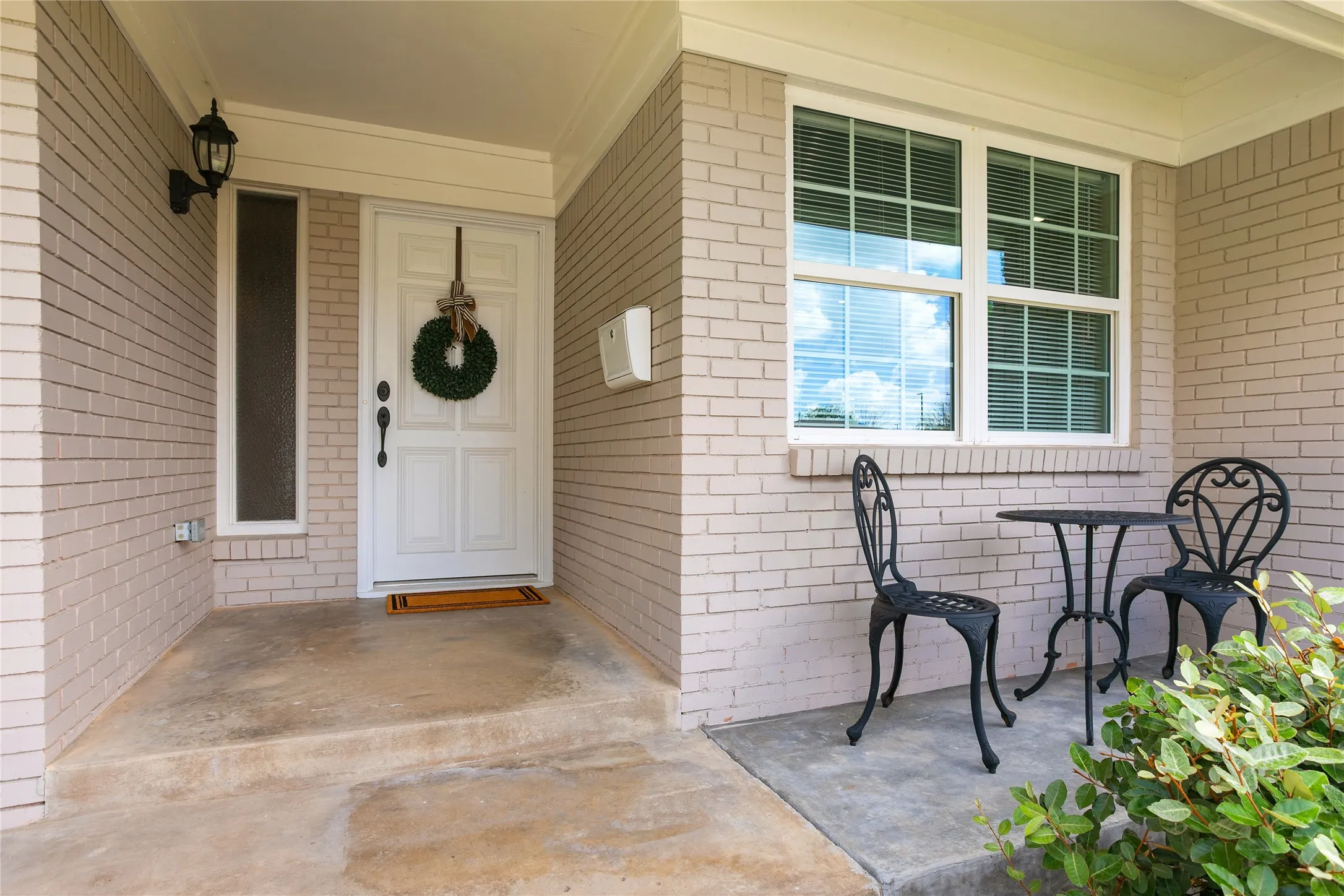 quaint cozy front porch with room for seating