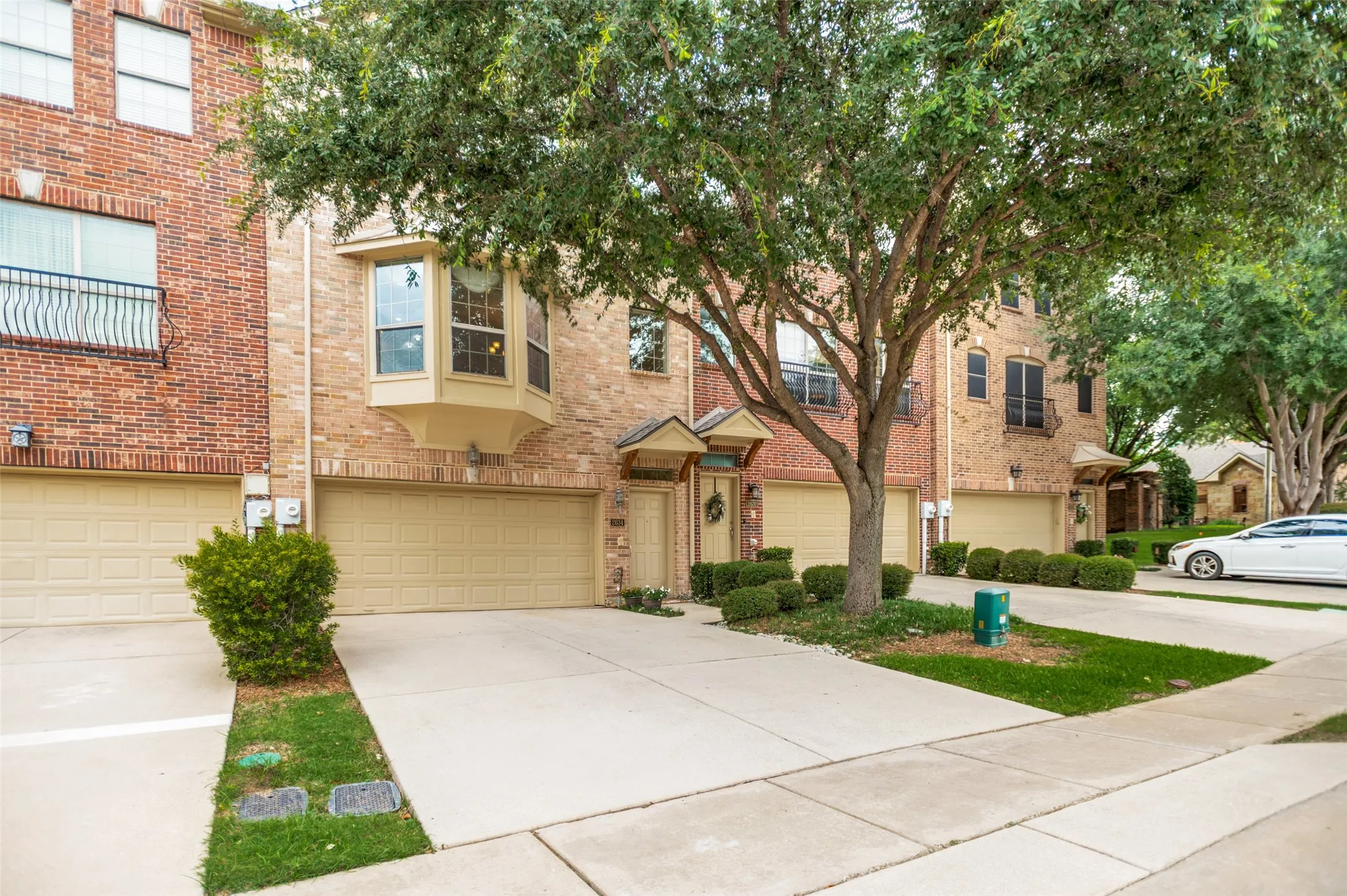 Brick townhome with an attached two-car garage
