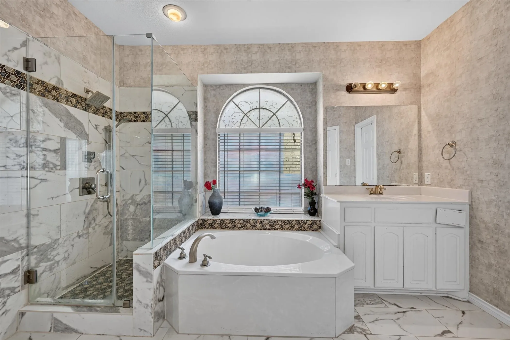 Corner soaking tub with deck-mounted faucet