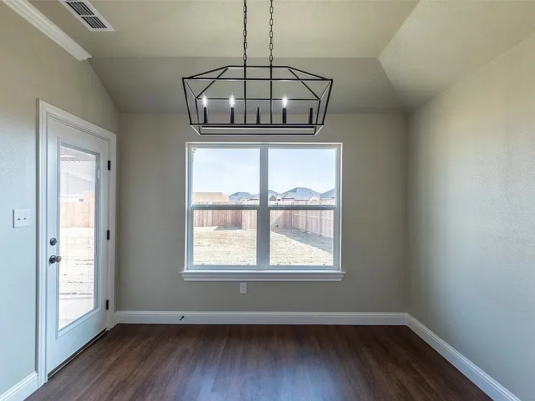 Tray ceiling with a modern geometric chandelier
