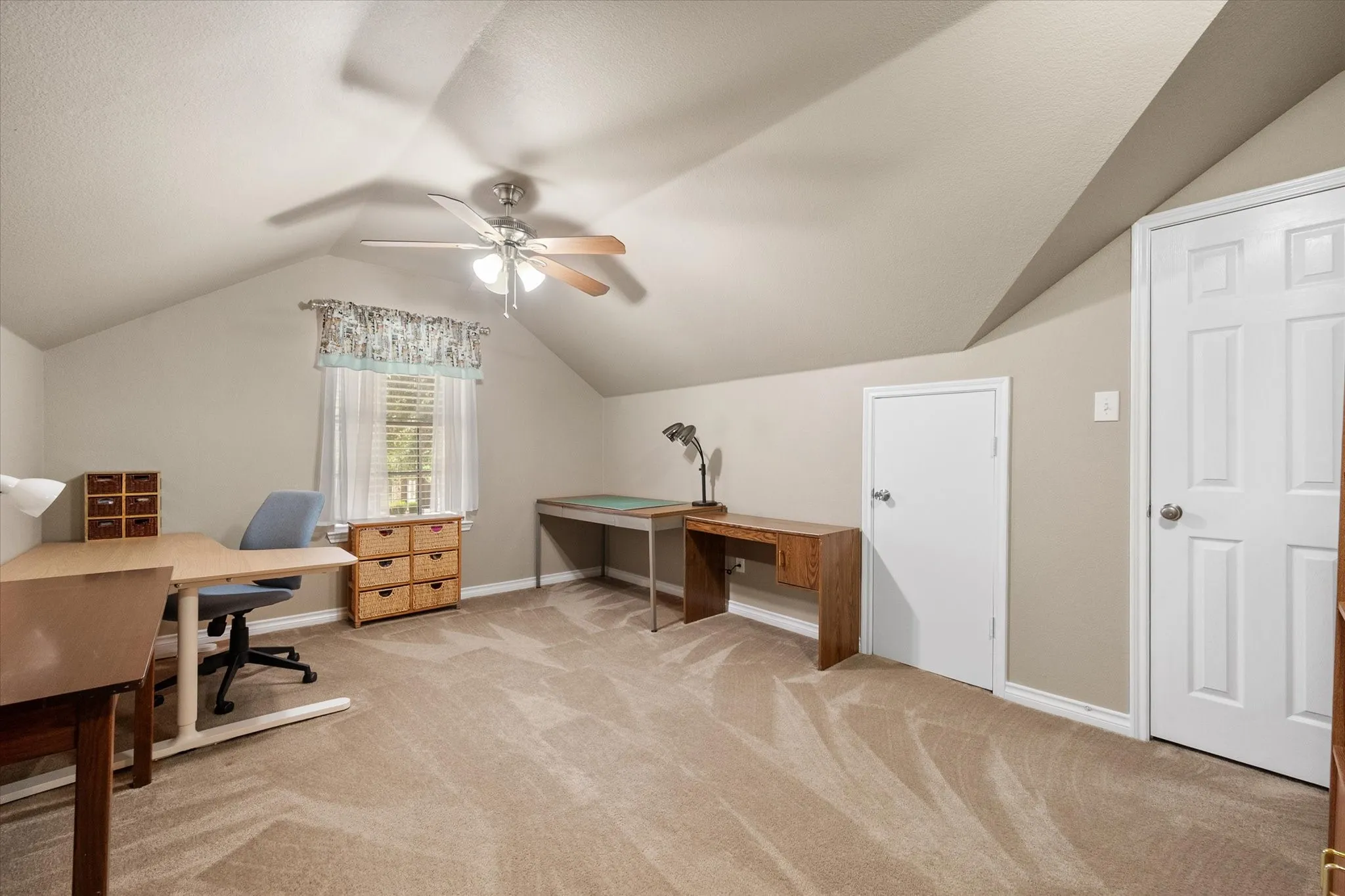 Spacious upstairs bonus room offers exceptional flexibility and can easily serve as a 5th bedroom thanks to its closet. Currently used as a hobby room, this versatile space is ideal for a home office, craft room, game room, media room, playroom, homeschool space, fitness room, or guest suite. The vaulted ceiling, natural light, and generous floor plan create a bright, comfortable retreat that adapts to your family's changing needs. A perfect flex space for today's lifestyle.