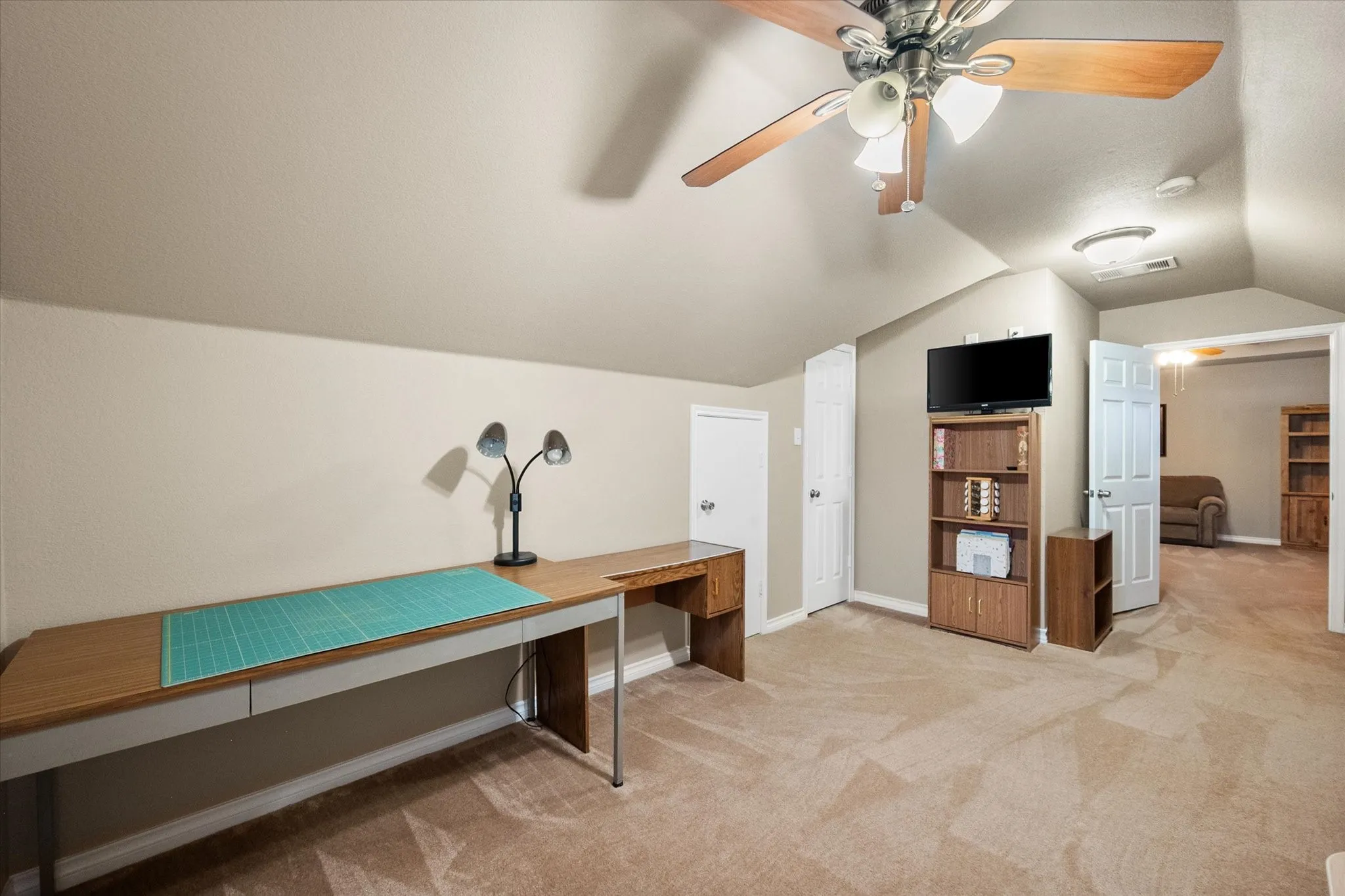 Spacious upstairs bonus room offers endless possibilities and can easily function as a 5th bedroom thanks to its closet and generous layout. Currently used as a craft and hobby room, this versatile flex space is perfect for a home office, media room, game room, playroom, homeschool room, fitness studio, or guest suite. An added bonus is the walk-in attic access, providing abundant, easy-to-reach storage for seasonal décor, luggage, and household items. With its spacious design, natural light, and exceptional storage, this upstairs retreat adapts to virtually any lifestyle need.