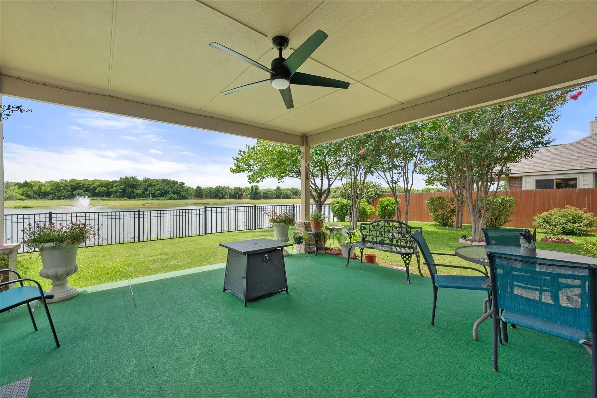 Enjoy breathtaking **waterfront views** from the **large covered patio**, perfectly designed for year-round outdoor living and entertaining. Overlooking a peaceful **greenbelt**, **scenic pond**, and **water feature fountain**, this backyard retreat offers exceptional privacy with no rear neighbors. The spacious covered patio features a **ceiling fan**, ample room for outdoor dining and lounge seating, and seamless access to the beautifully maintained yard. Whether you're enjoying your morning coffee, hosting gatherings, or relaxing at sunset, this **pond-view backyard** delivers the perfect blend of comfort, tranquility, and picturesque outdoor living.
