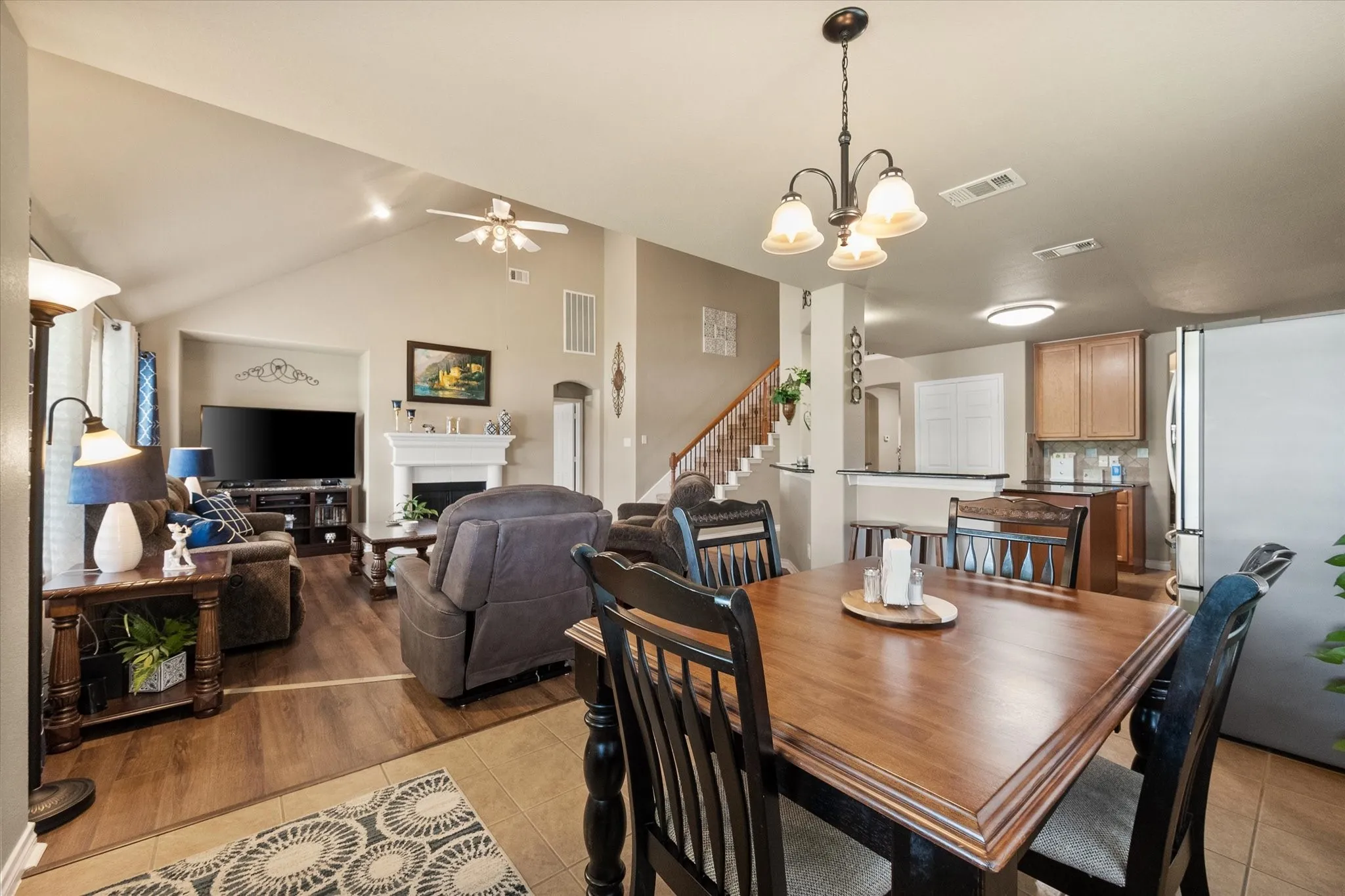 The inviting breakfast room flows seamlessly into the spacious living room, creating an open-concept layout that is perfect for modern living and effortless entertaining. This thoughtfully designed space keeps everyone connected, whether you're enjoying casual family meals, hosting holiday gatherings, or entertaining guests. The open sightlines enhance the home's spacious feel, while the soaring ceilings and abundant natural light create a bright, welcoming atmosphere. Conveniently located between the kitchen and living area, this versatile dining space is ideal for everyday dining and social gatherings alike.