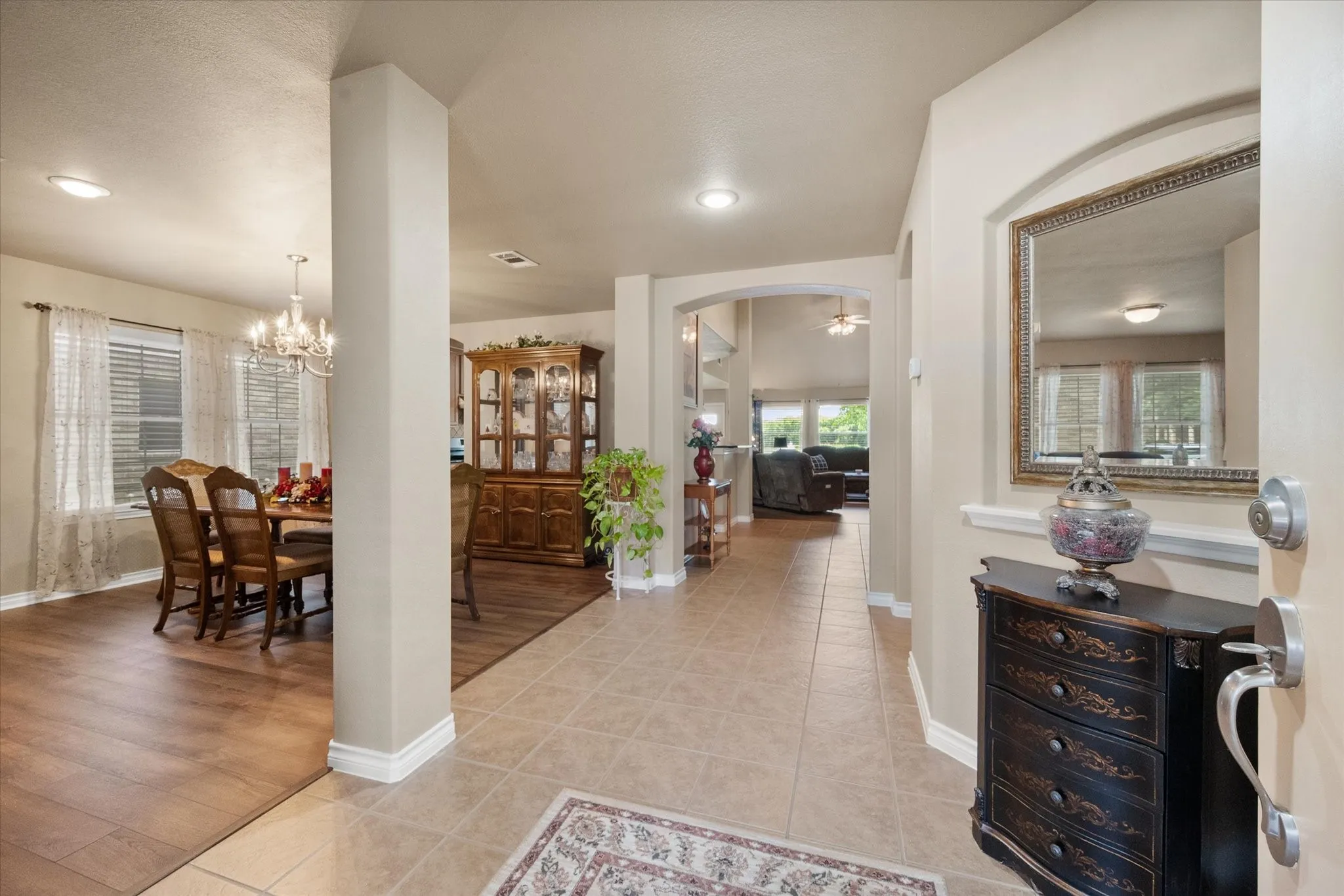 The ceramic tile entry makes clean up a breeze. Notice the architectural details of the grand entrance. Warm, neutral tones are found though-out the home.