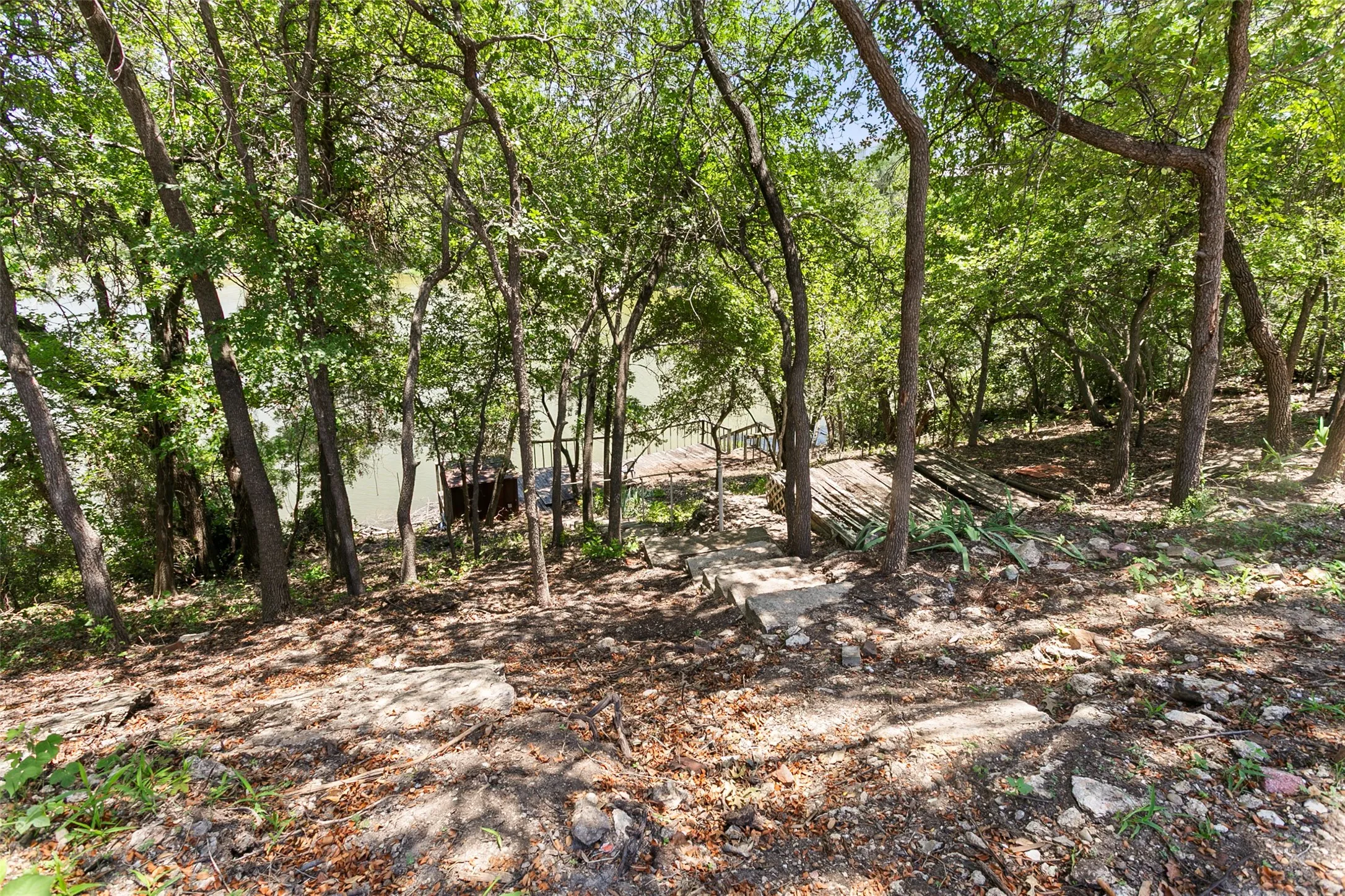 Back yard leading down to lake and dock