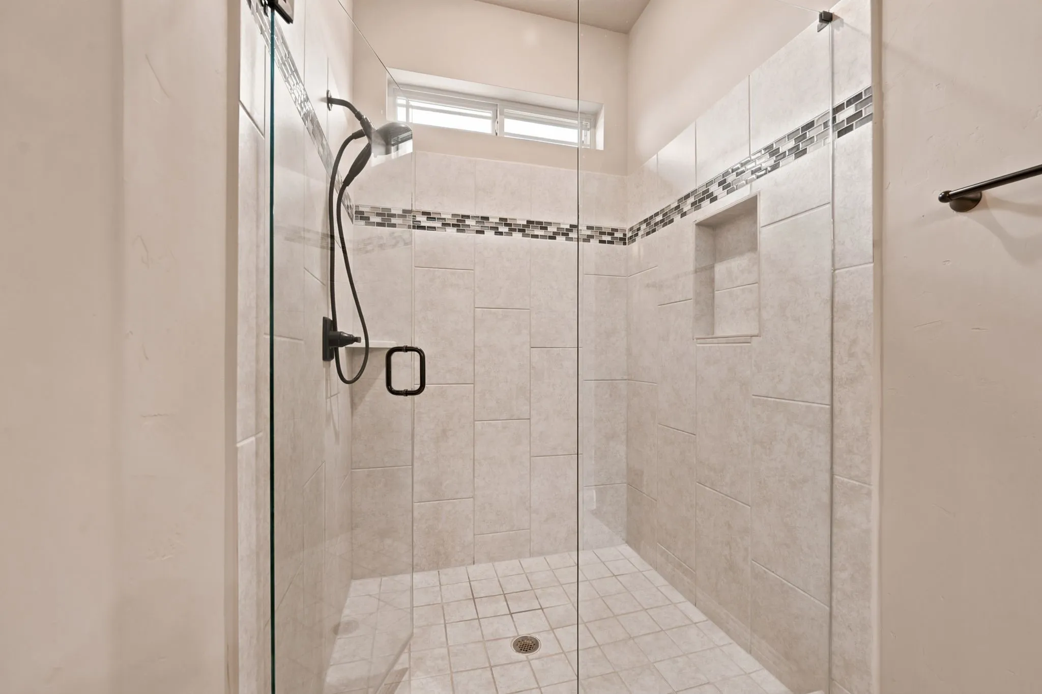 The Primary Bath includes a large walk in tiled shower.