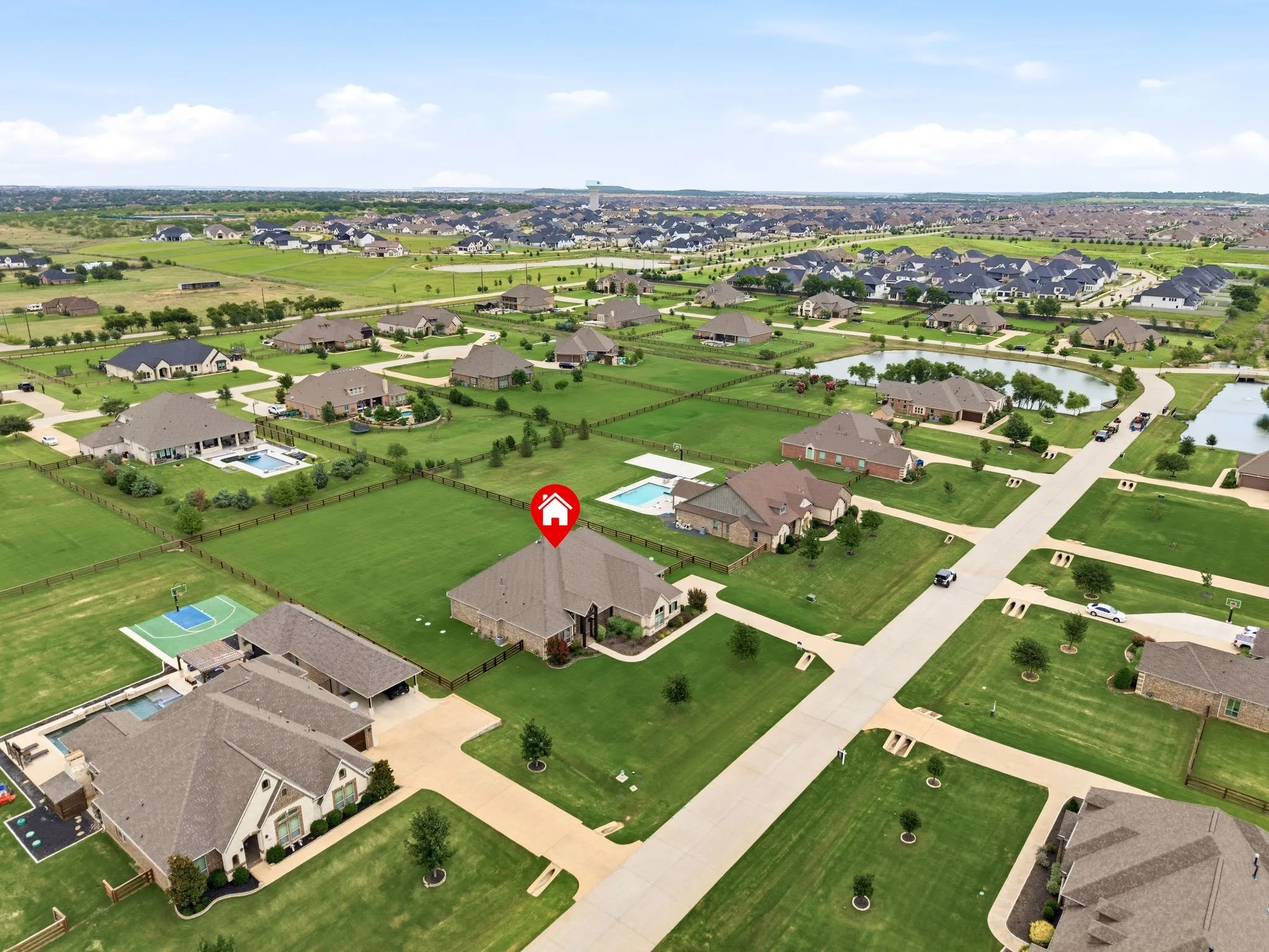 Subject property with view of pond down the street