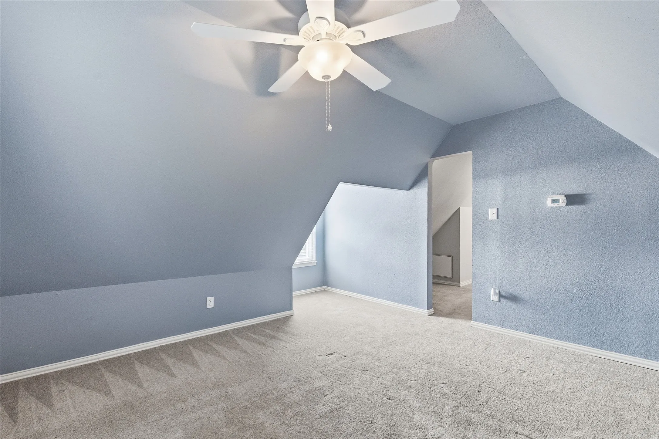 Bonus room above garage with half bath nearby.