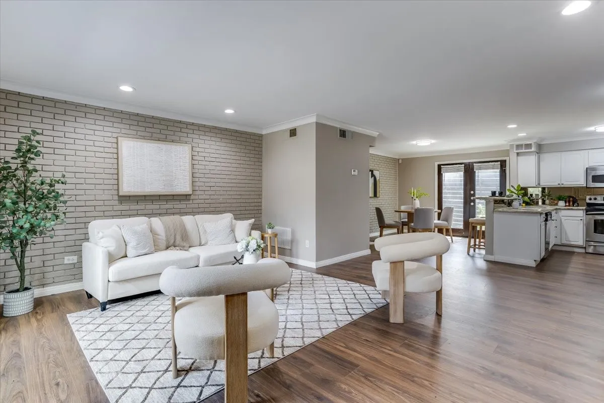 Open-concept living space with wood-finish flooring throughout