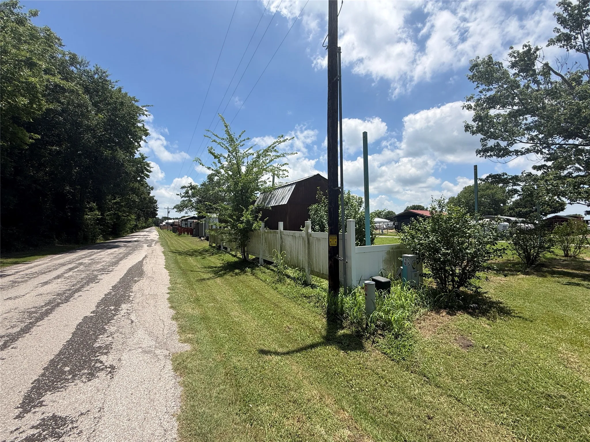 Roadside view along Blue Heron Way beside the property.