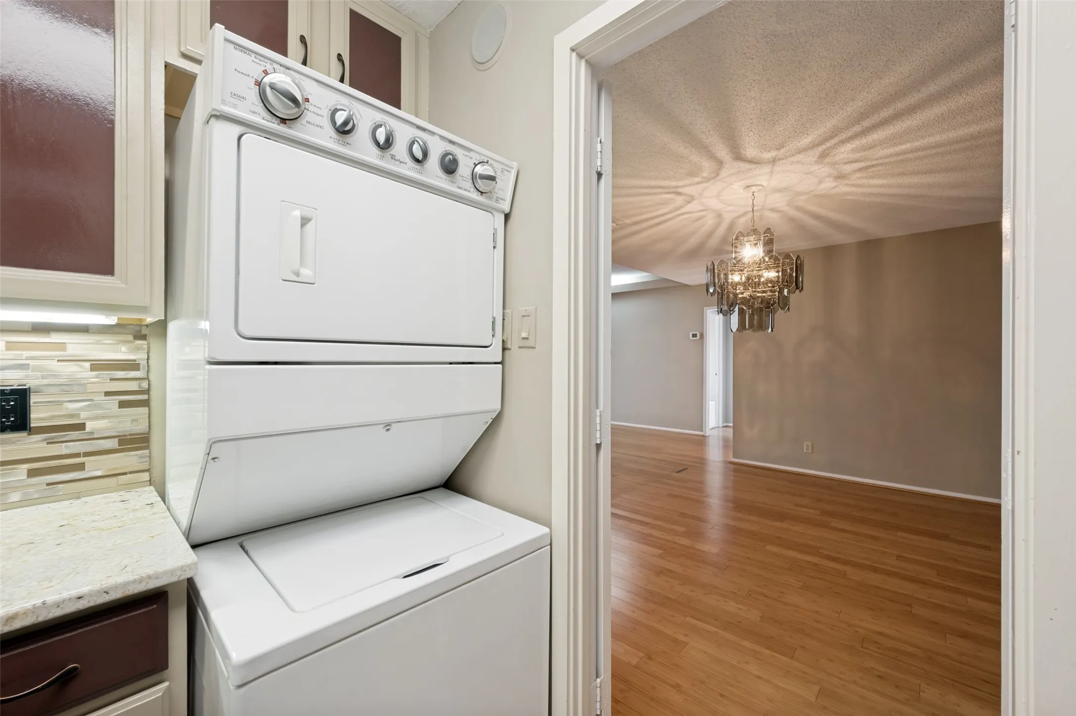 Stacked washer & dryer in kitchen