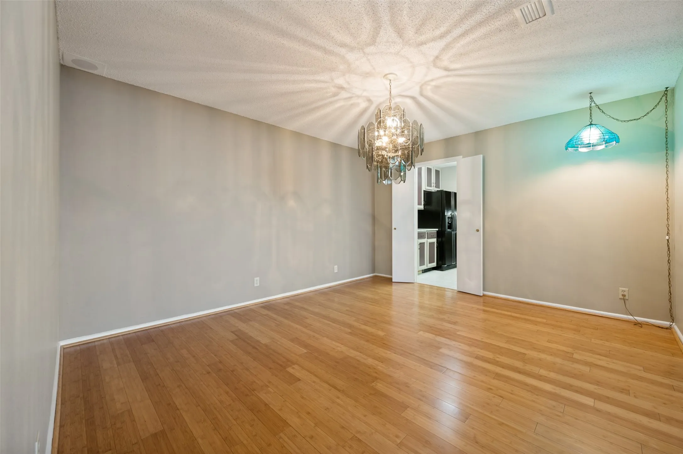 Large dining room with access to the kitchen.