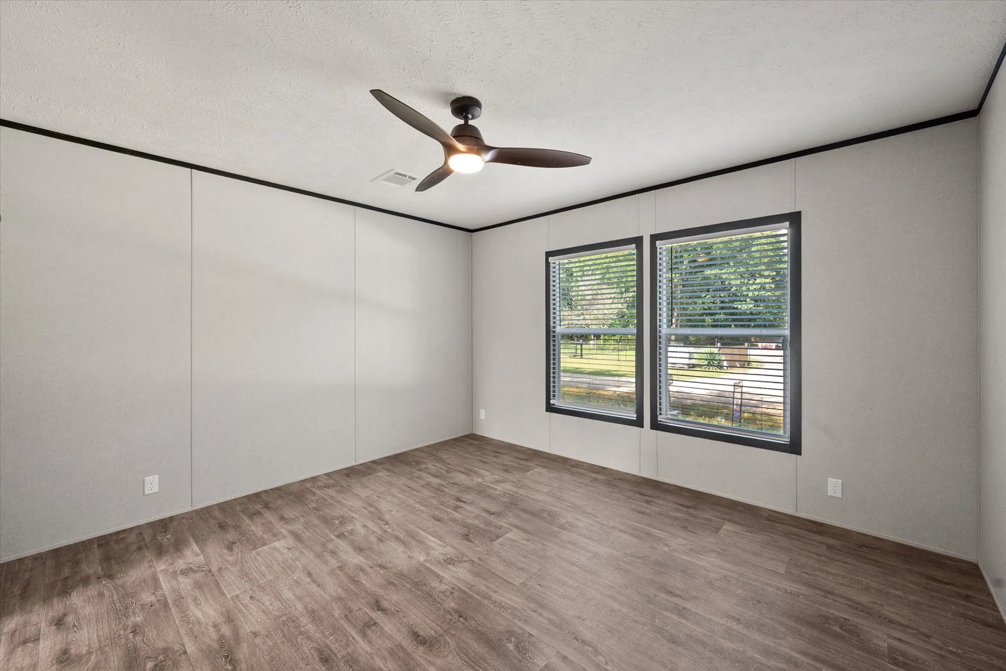 View of the primary bedroom from the living room entrance.