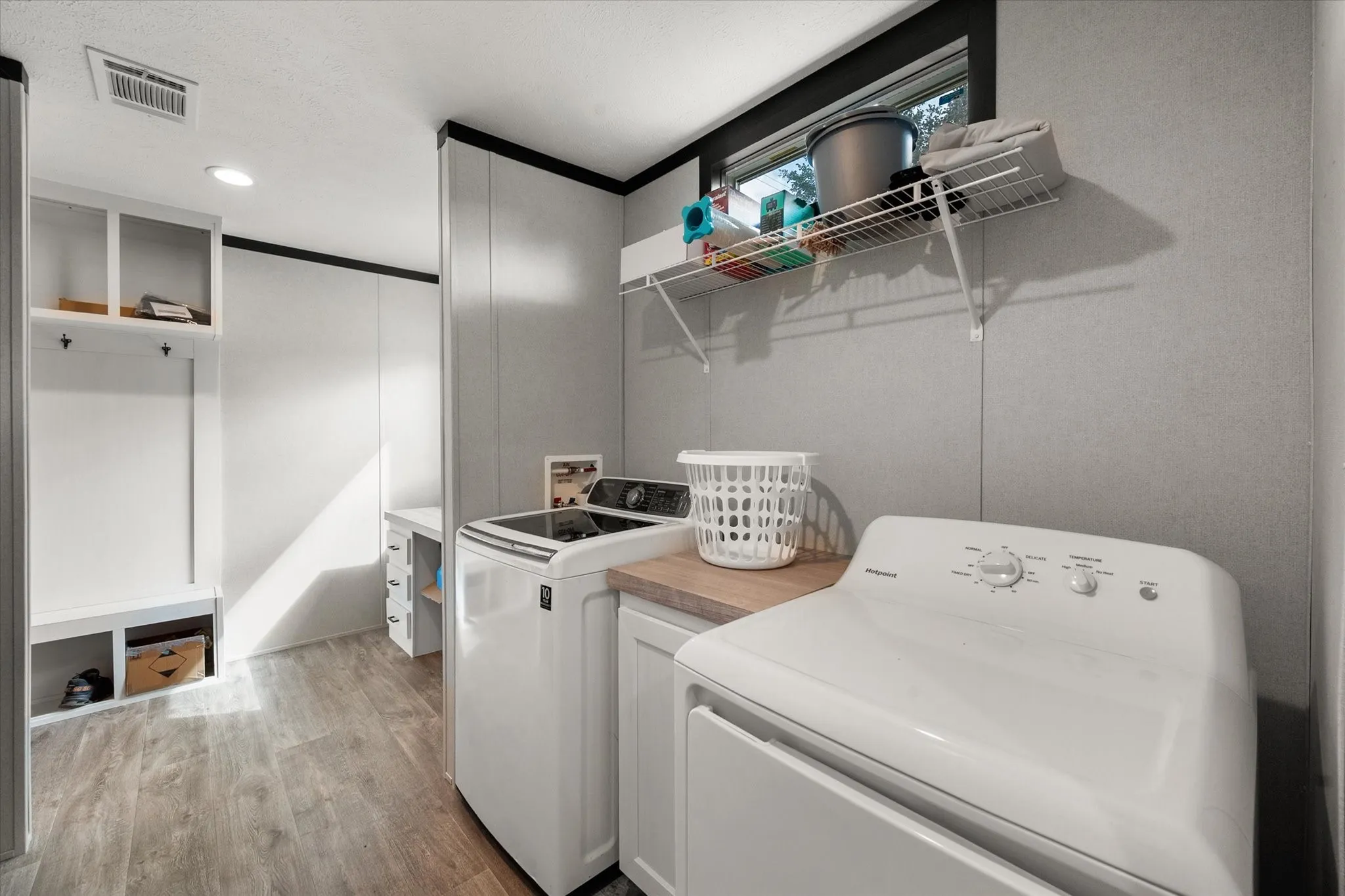 Laundry room, open to the desk & mudroom cubby.