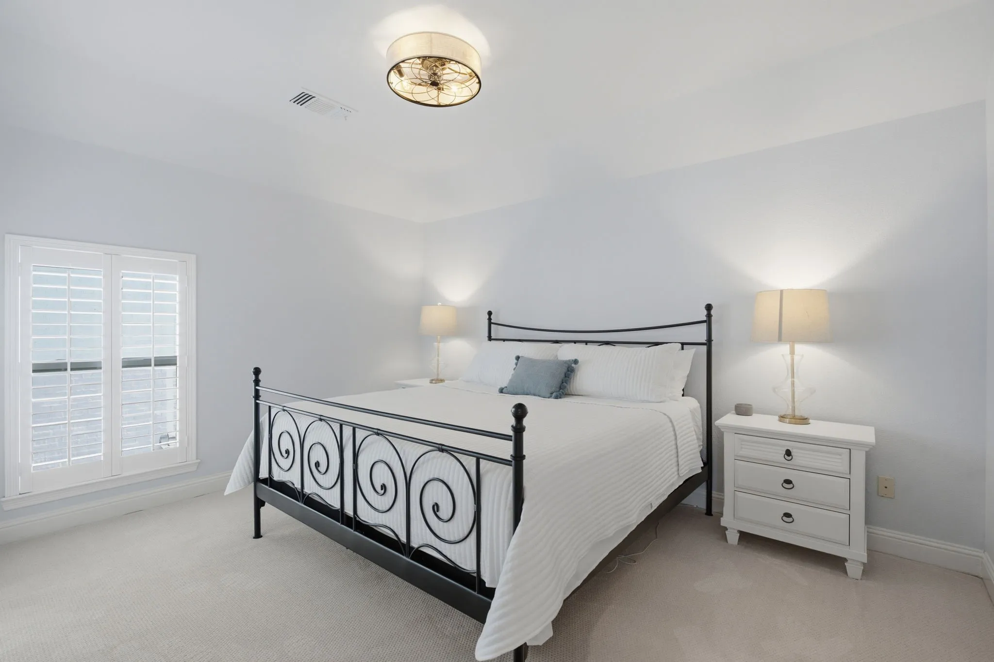 This spacious upstairs secondary bedroom is a true highlight of the home, featuring generous dimensions and elegant plantation shutters that allow for natural light control. The room is equipped with a modern ceiling fan for optimal comfort and includes the convenience of a large walk-in closet for ample storage. Additionally, it offers the practical benefit of direct access to a well-appointed Jack and Jill bathroom, making it an ideal retreat for family members or guests.