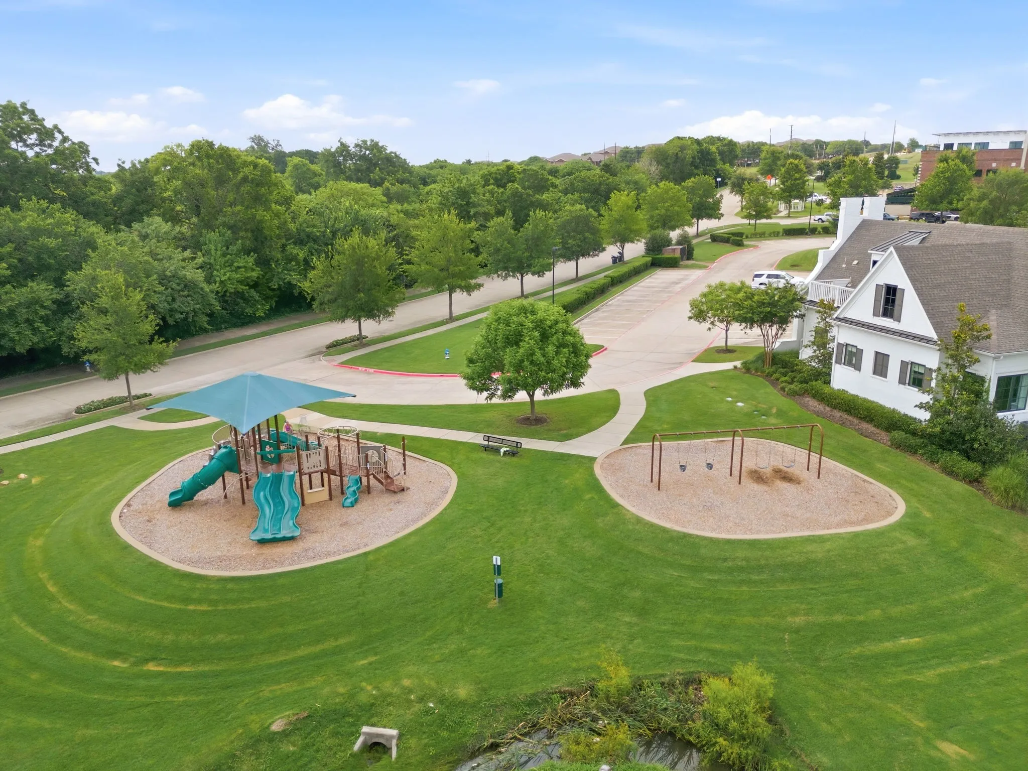 This community features a fantastic neighborhood park that is perfect for families, offering a well-maintained playground area complete with modern, safe swings for children to enjoy.