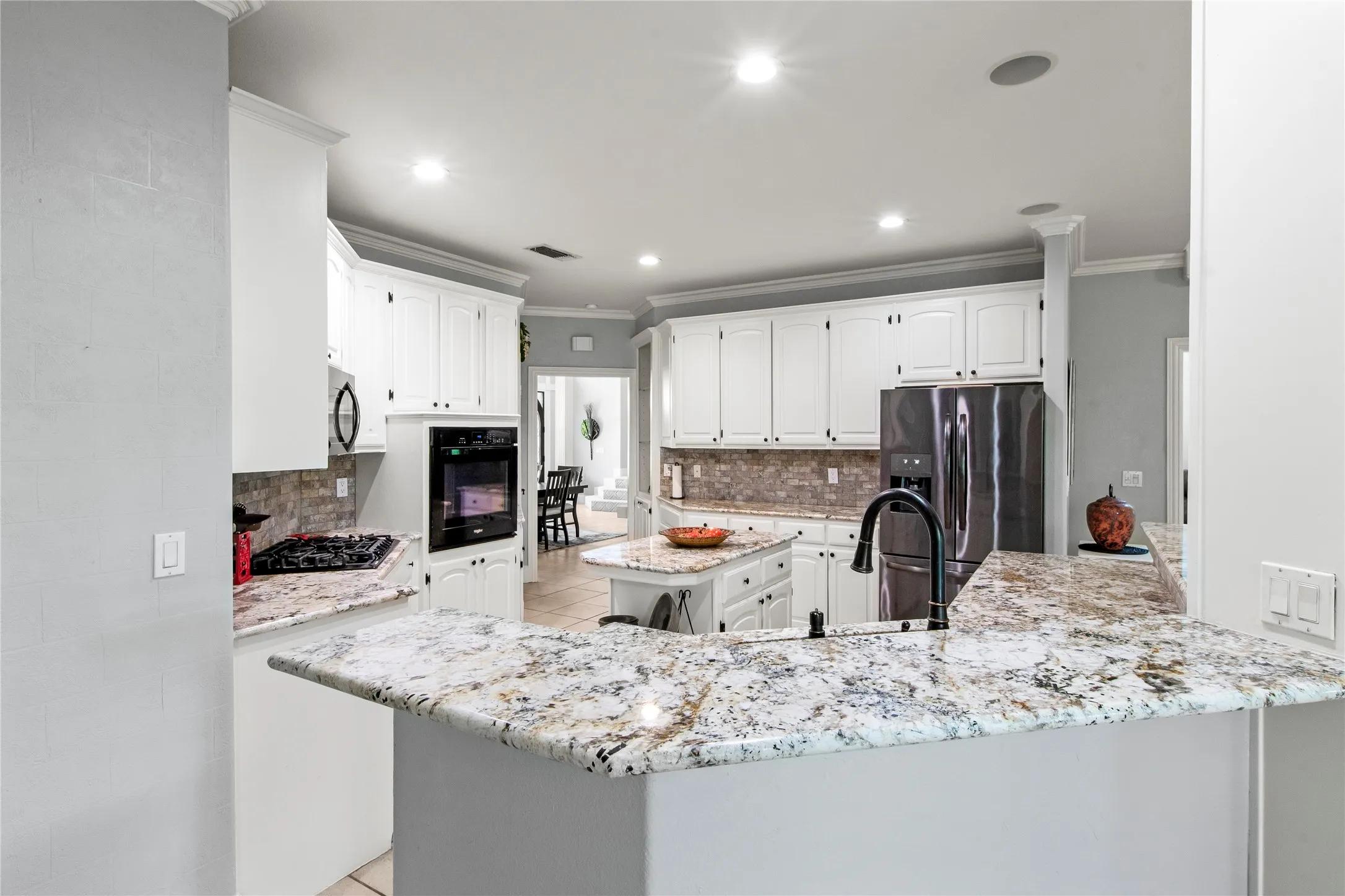 Open kitchen with island and bar seating