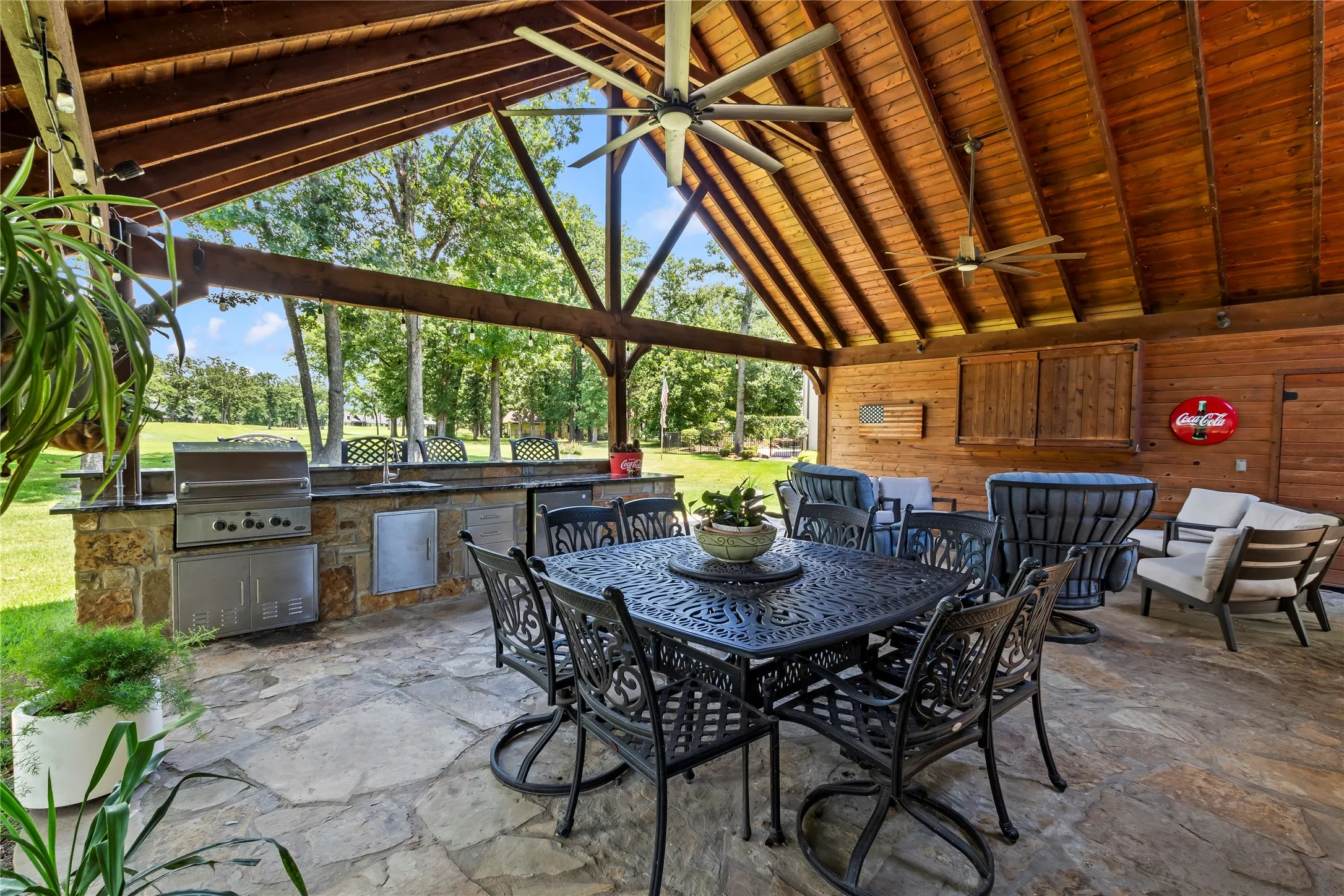 Covered patio with outdoor kitchen overlooking the golf course