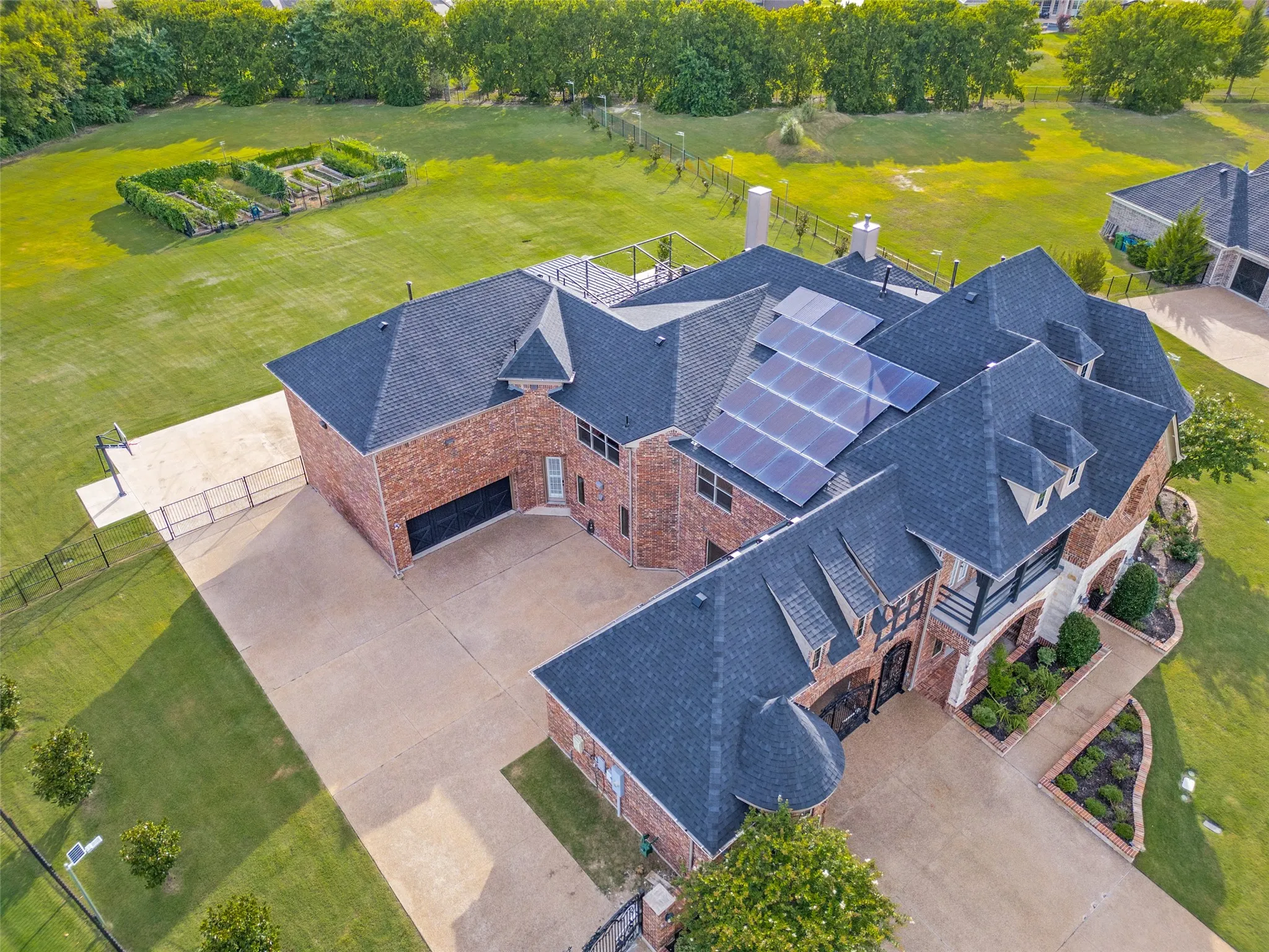 Aerial view showing the full aray of solar panels and motor court area.