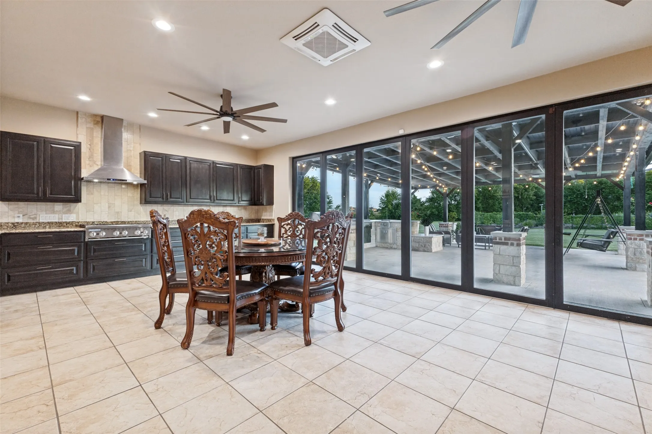 Spice kitchen over looks the covered patio and outdoor kitchen.