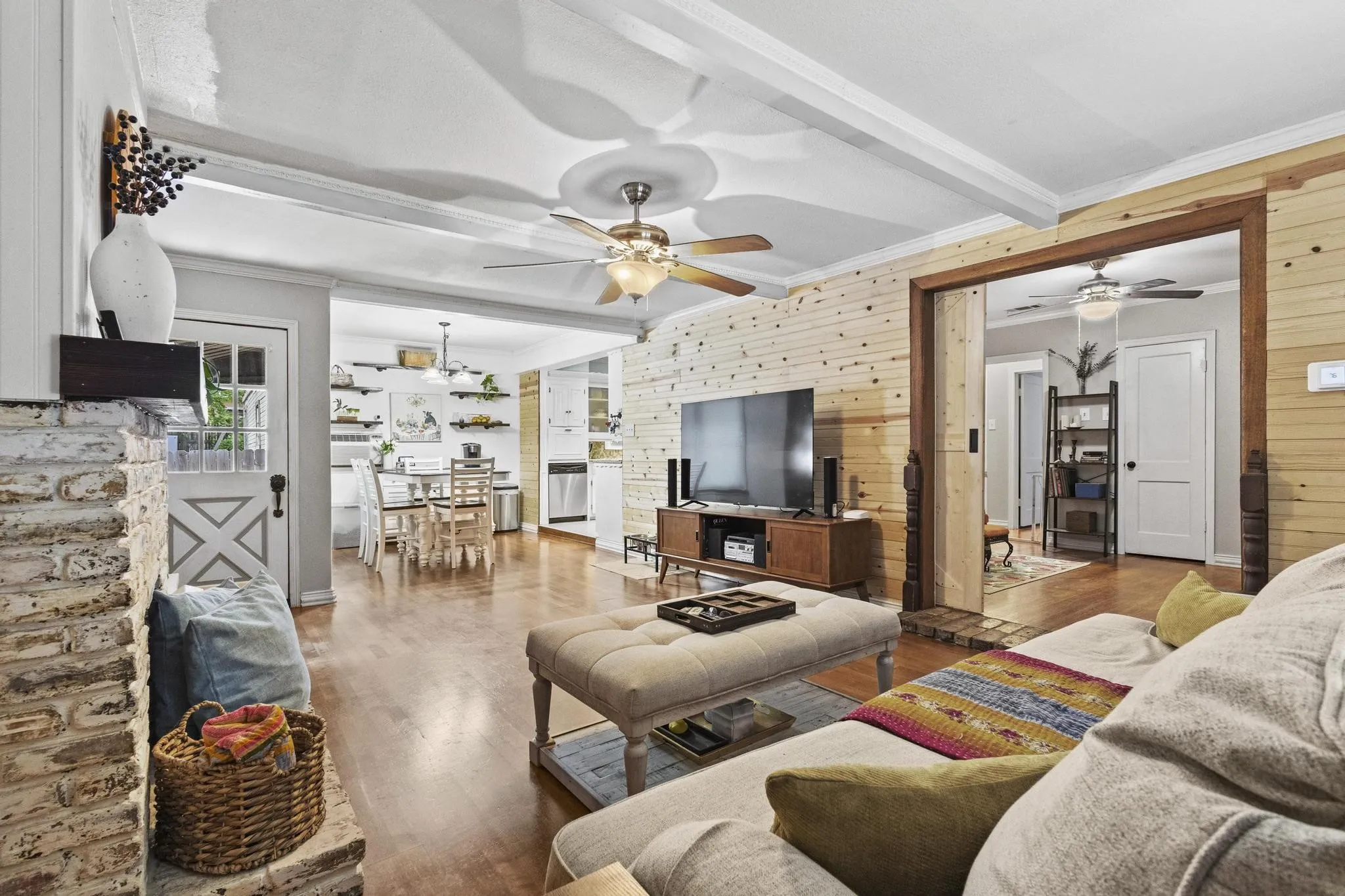 Large living room with natural light and easy access to dinning area and kitchen