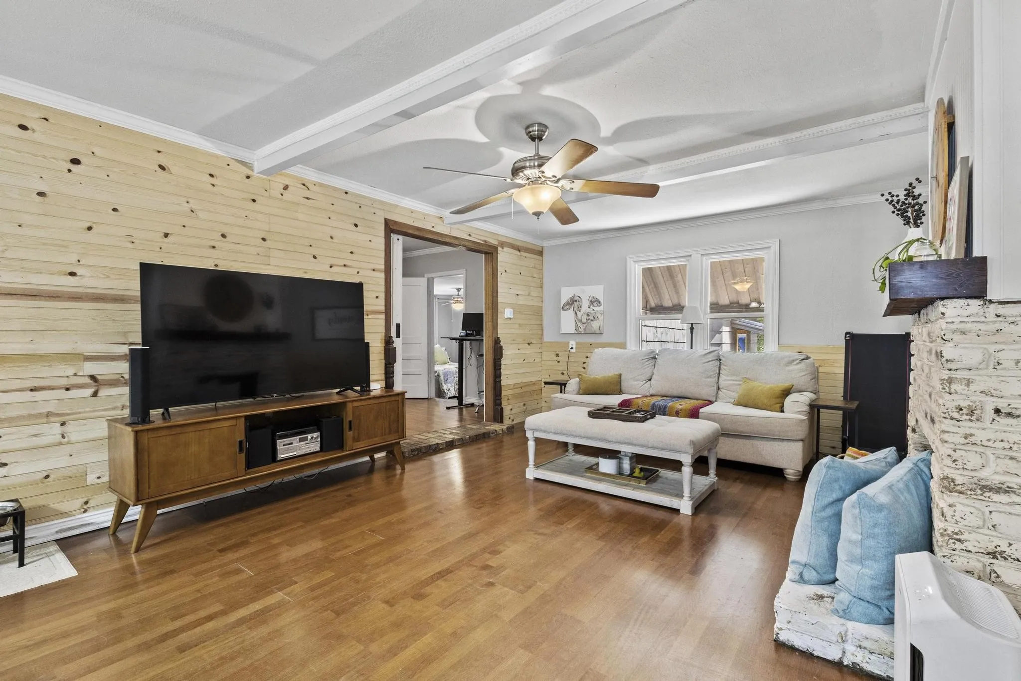 Large living room with natural light and easy access to dinning area and kitchen