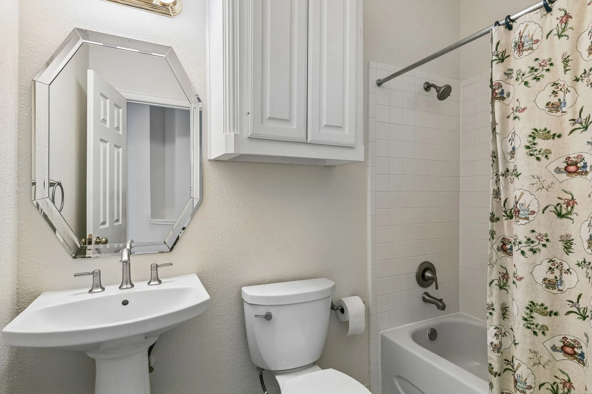 Whether it's bubble baths, bedtime routines, or getting ready for the day ahead, this full bathroom is ready for it all! Complete with a tub-shower combo, spacious vanity, toilet, and plenty of storage cabinetry.