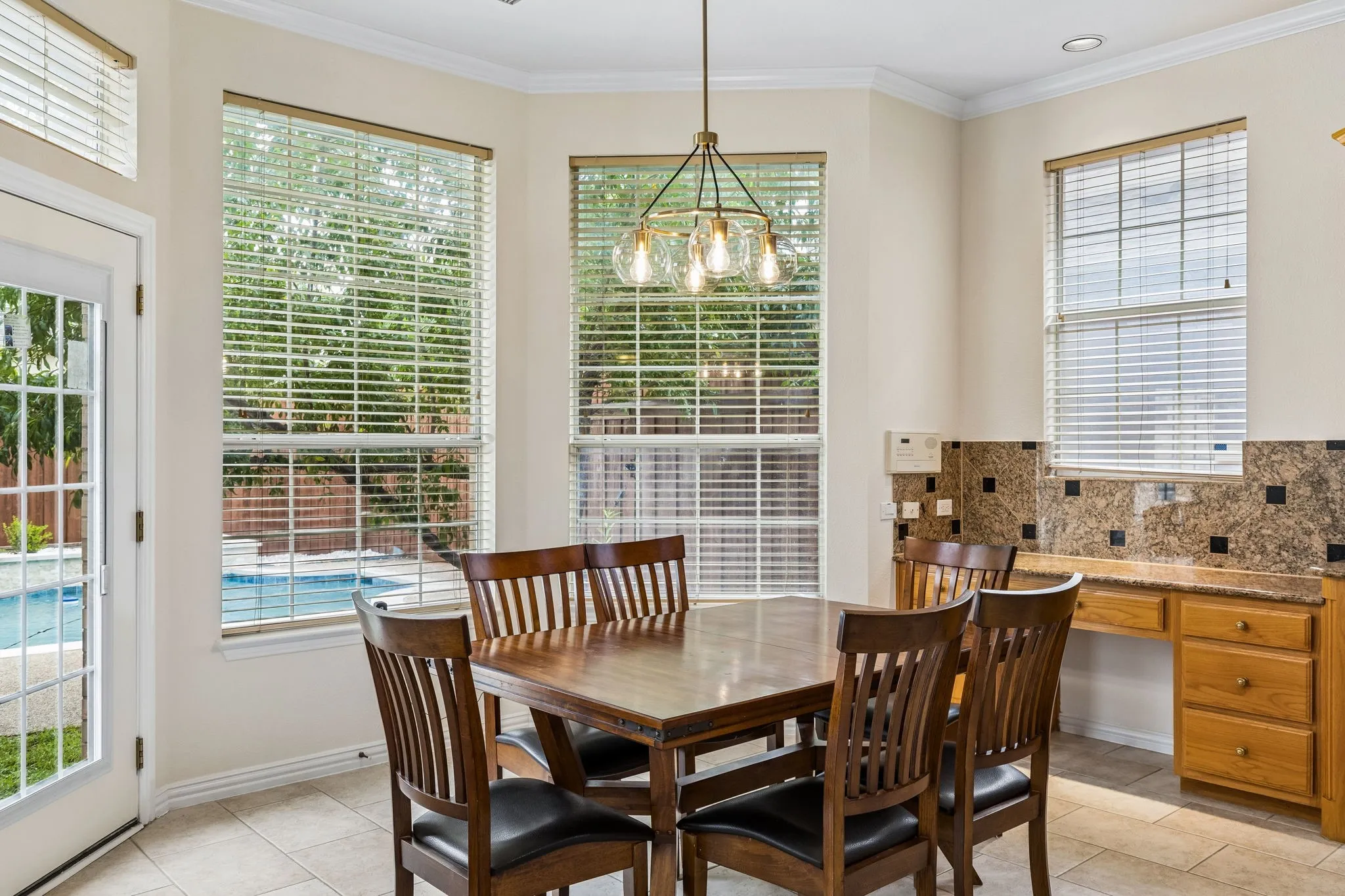The large kitchen opens to the breakfast room and living room where the chef will still be able to enjoy and interact with family and friends while meals are being prepared for everyone. Here a window, there a window!