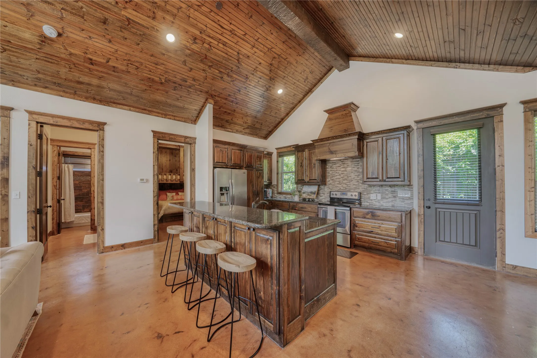 Guest House Kitchen With Island And Bar Seating