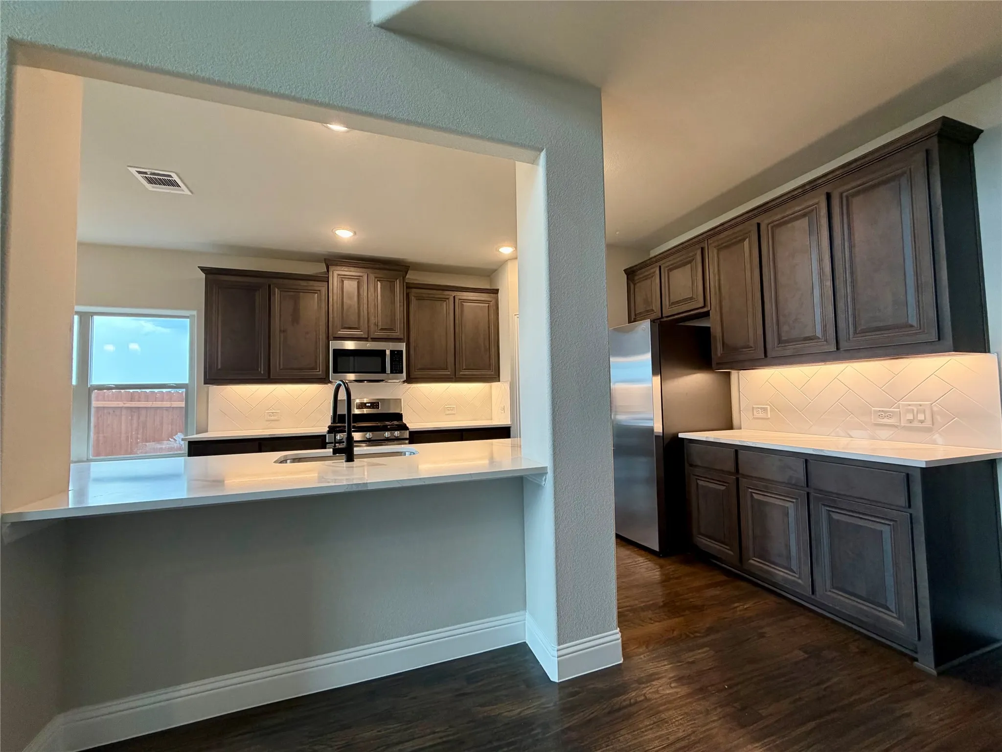 Look at all this natural light and counter space in this kitchen