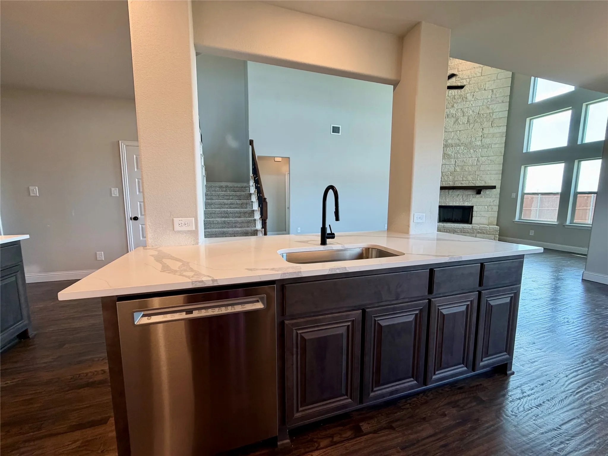 Kitchen island has  sink and single basin stainless sink with Matte Black extendable sprayer faucet