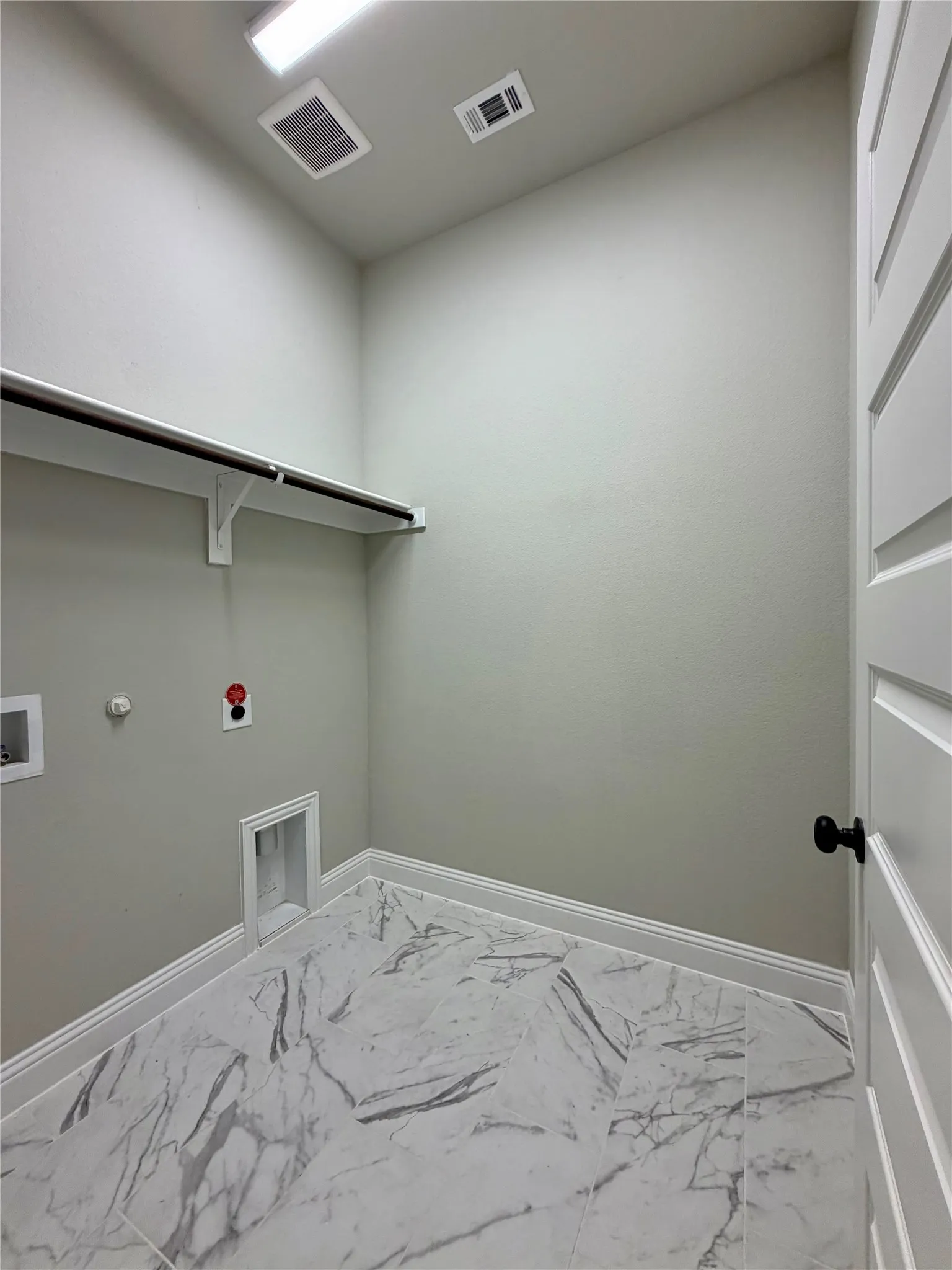 Laudry room is a separate space that is not a traffic area
