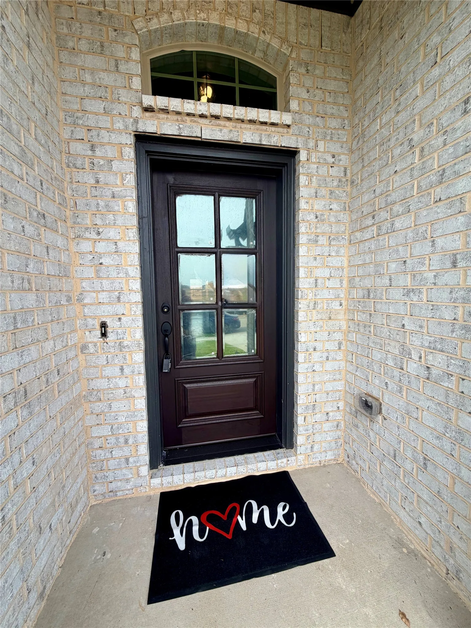 Welcoming entry with glass Mission-style door (final stain not applied yet)