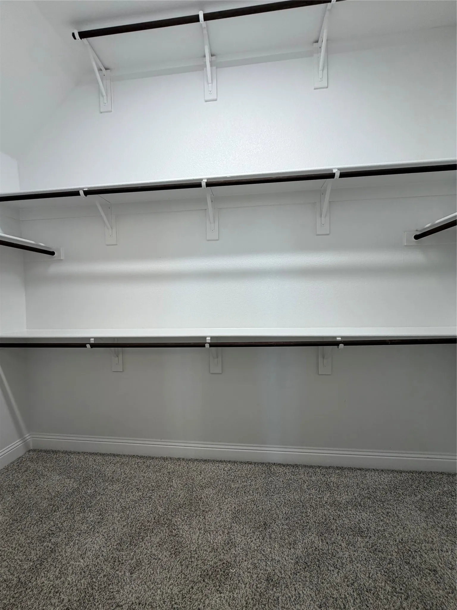 Large Master closetwith 3rd rod for seasonal storage