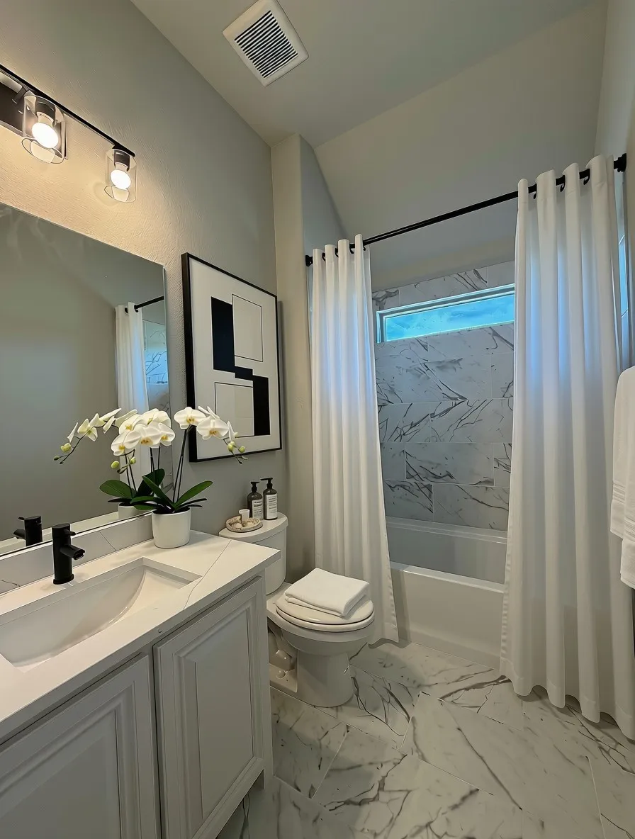 Beth 2 has 12x24 marble-style tile, Lincoln Quartz counters, and White raised-panel cabinets
