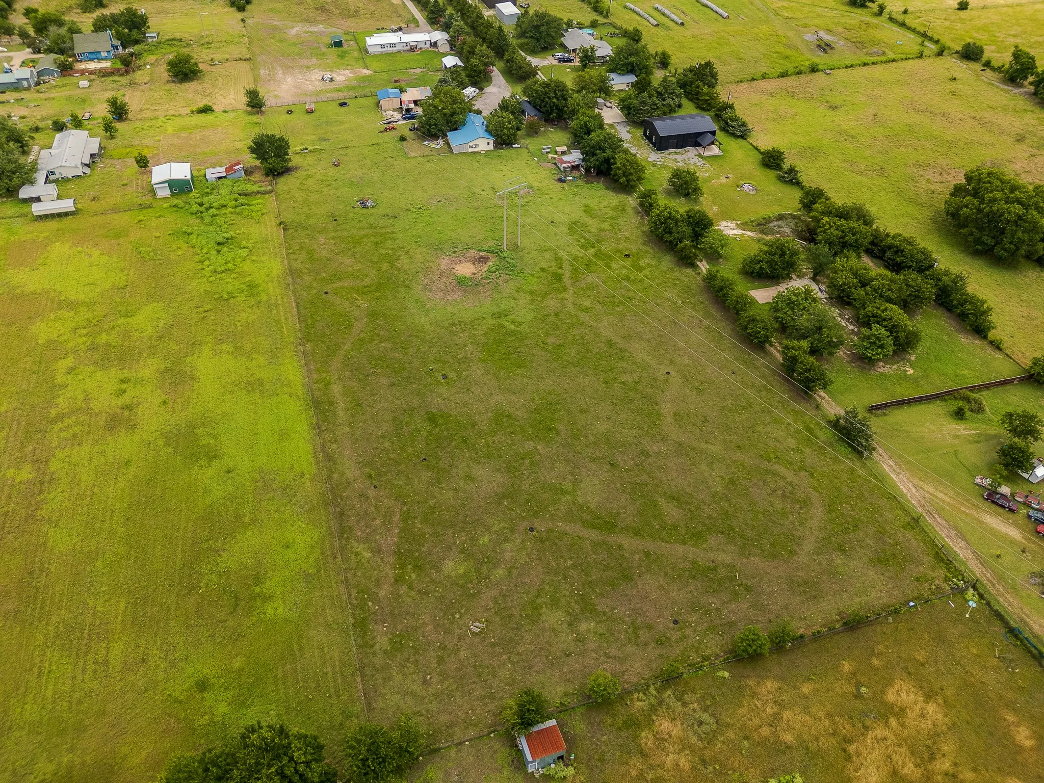 Expansive Acreage with Multiple Improvements