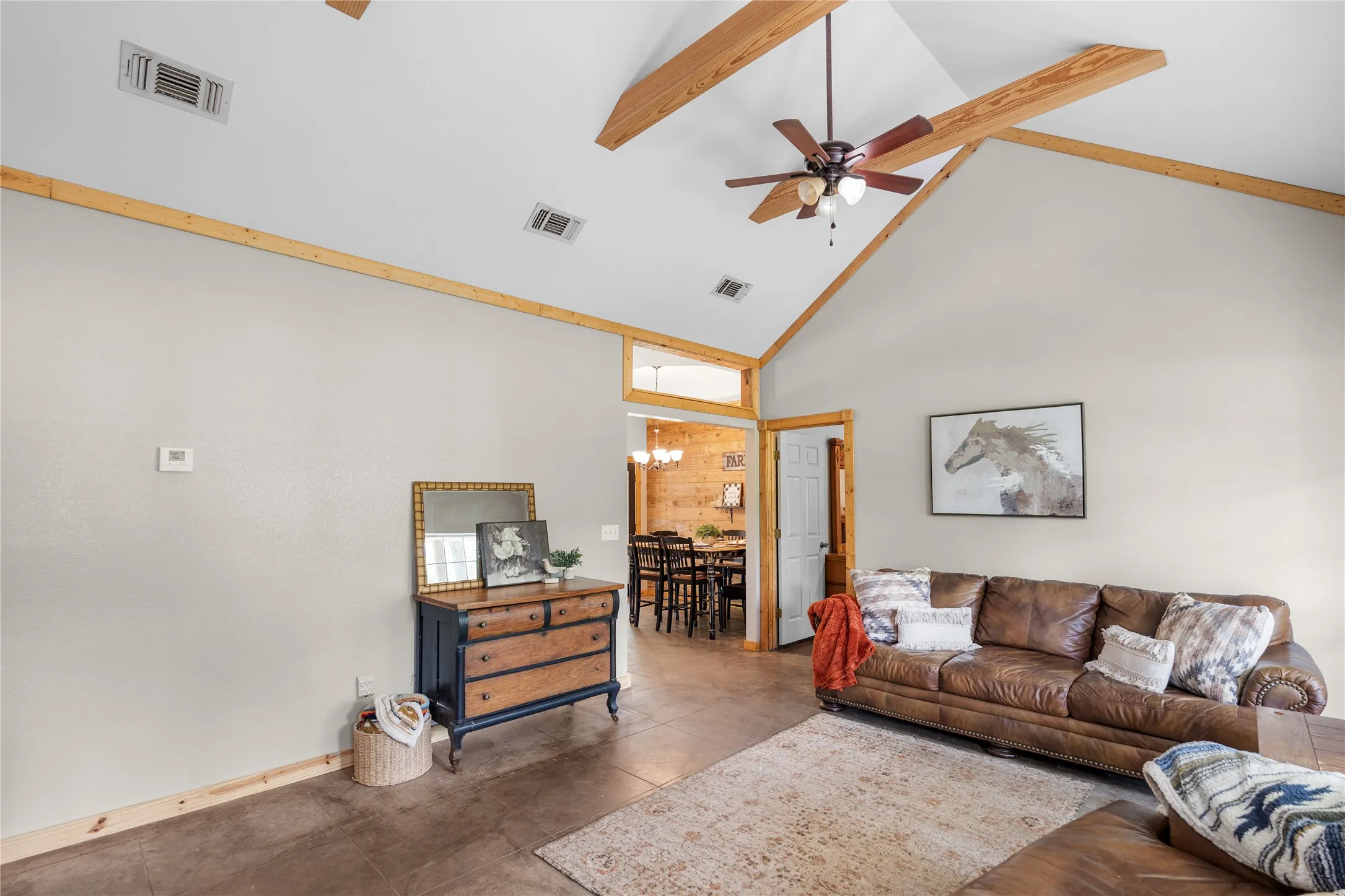 Living area with vaulted ceiling and exposed wood beams