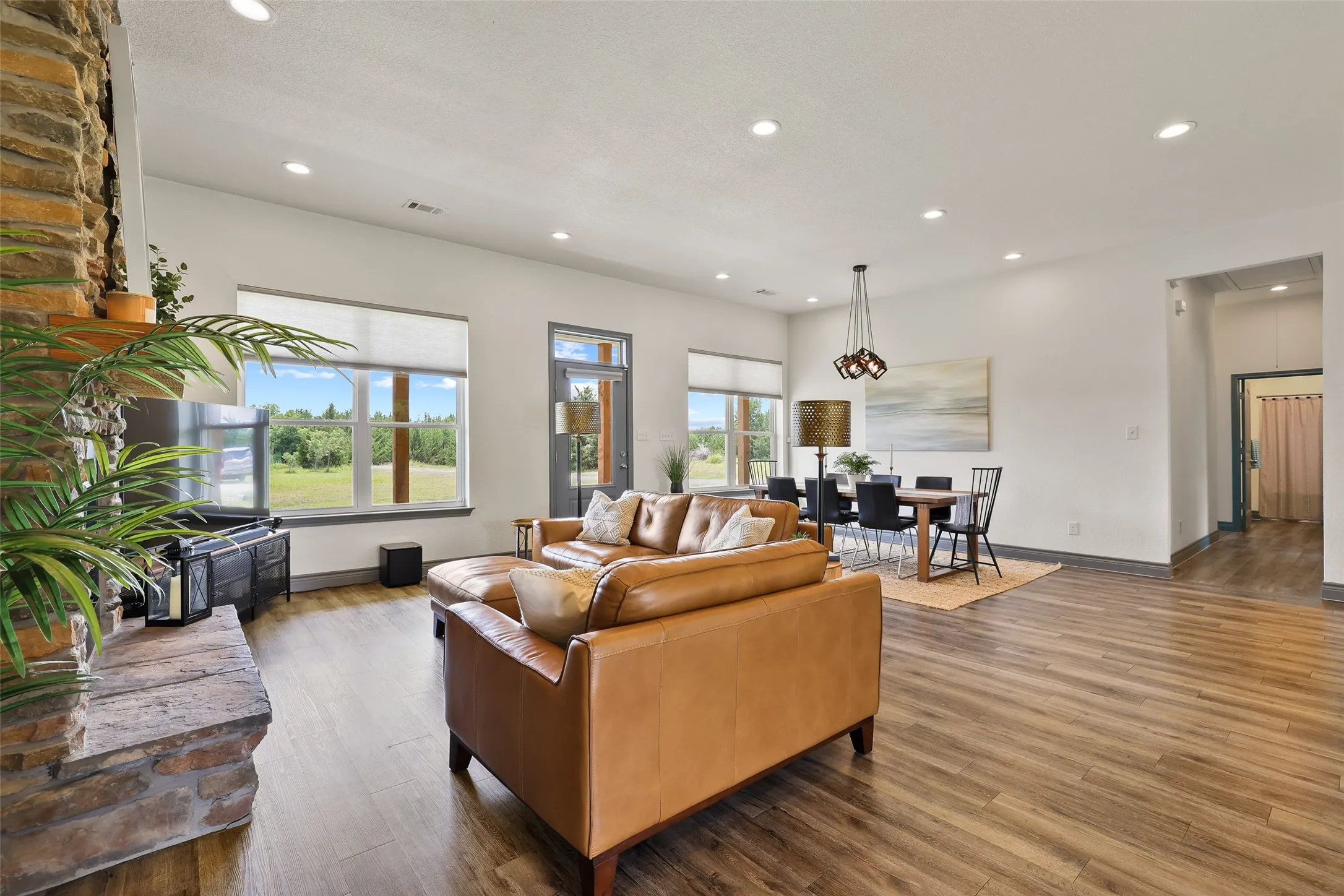 Spacious interior with wood-finish flooring and recessed lighting
