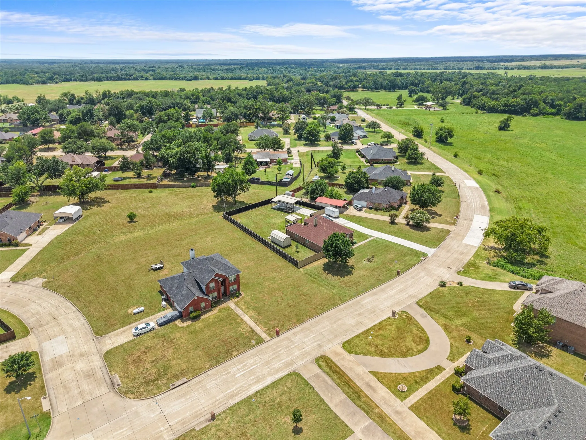 Aerial perspective showcasing residential properties with established trees
