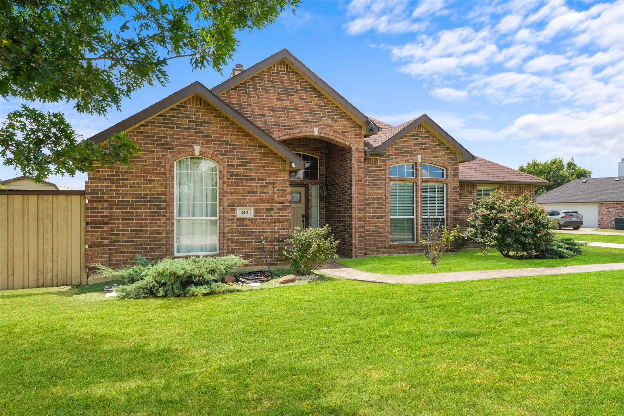 Brick exterior with arched entry