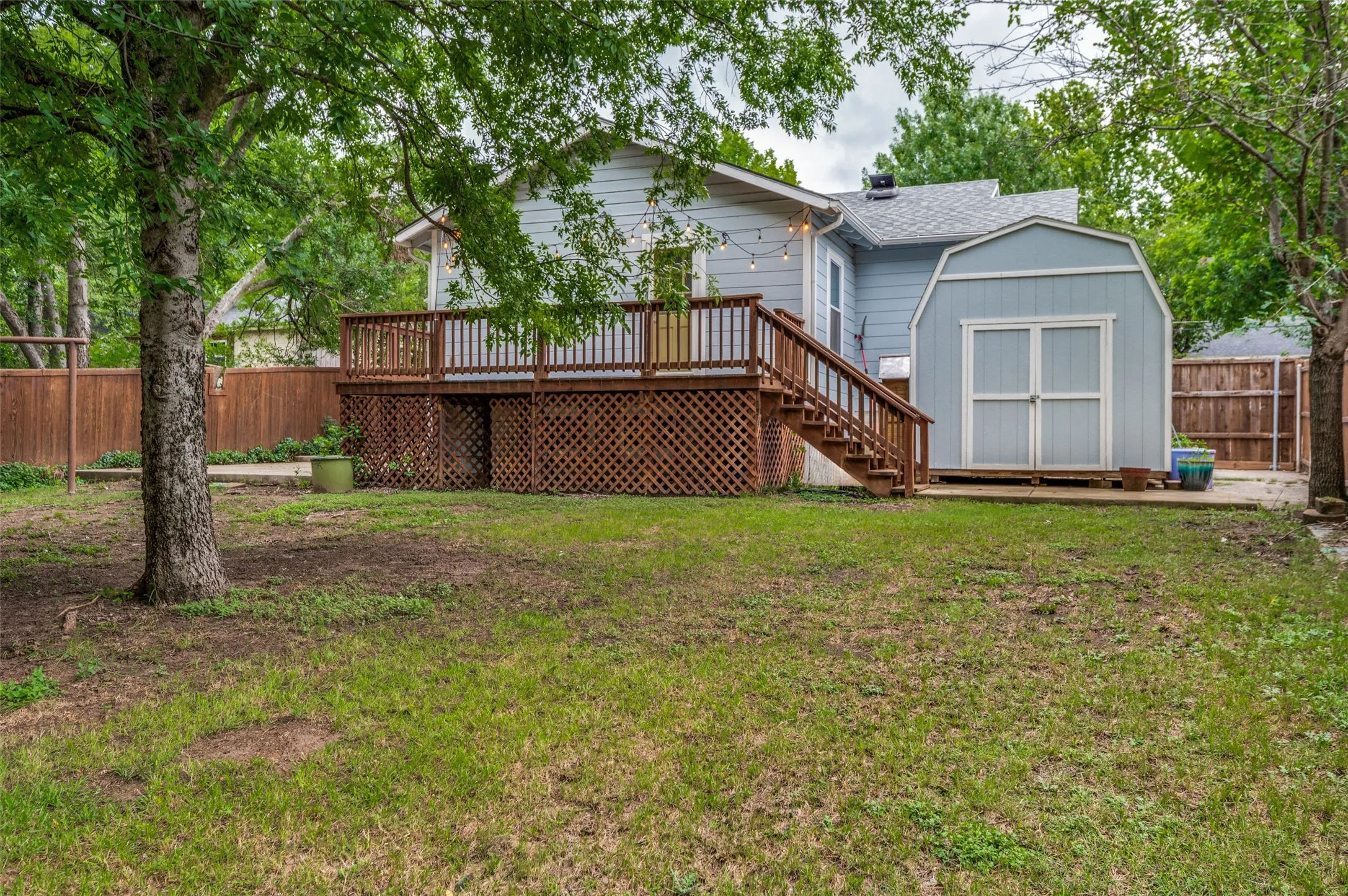 LARGE BACK YARD WITH SHED THAT CONVEYS WITH PROPERTY
