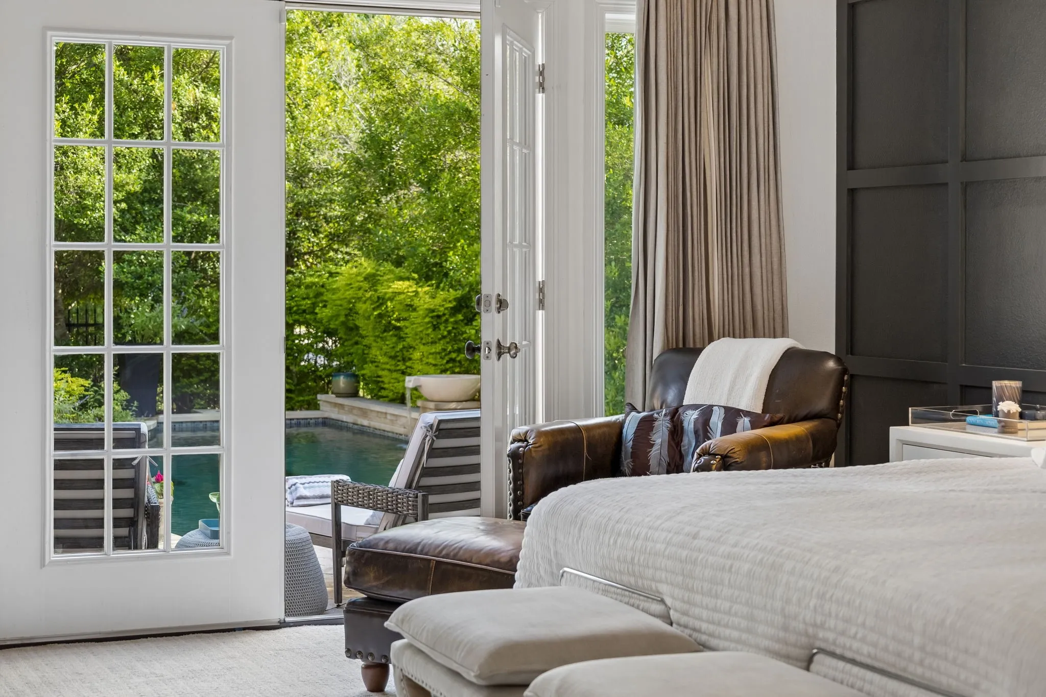 Primary Suite- Doors open to outdoors - pool views