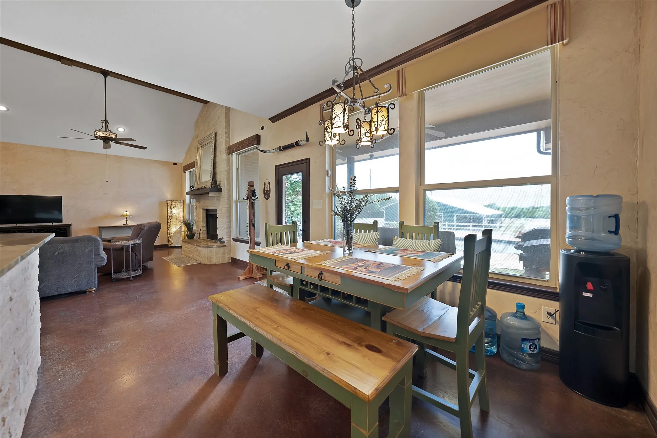 Dining adjoins kitchen and all open to living room with backyard oasis thru the door