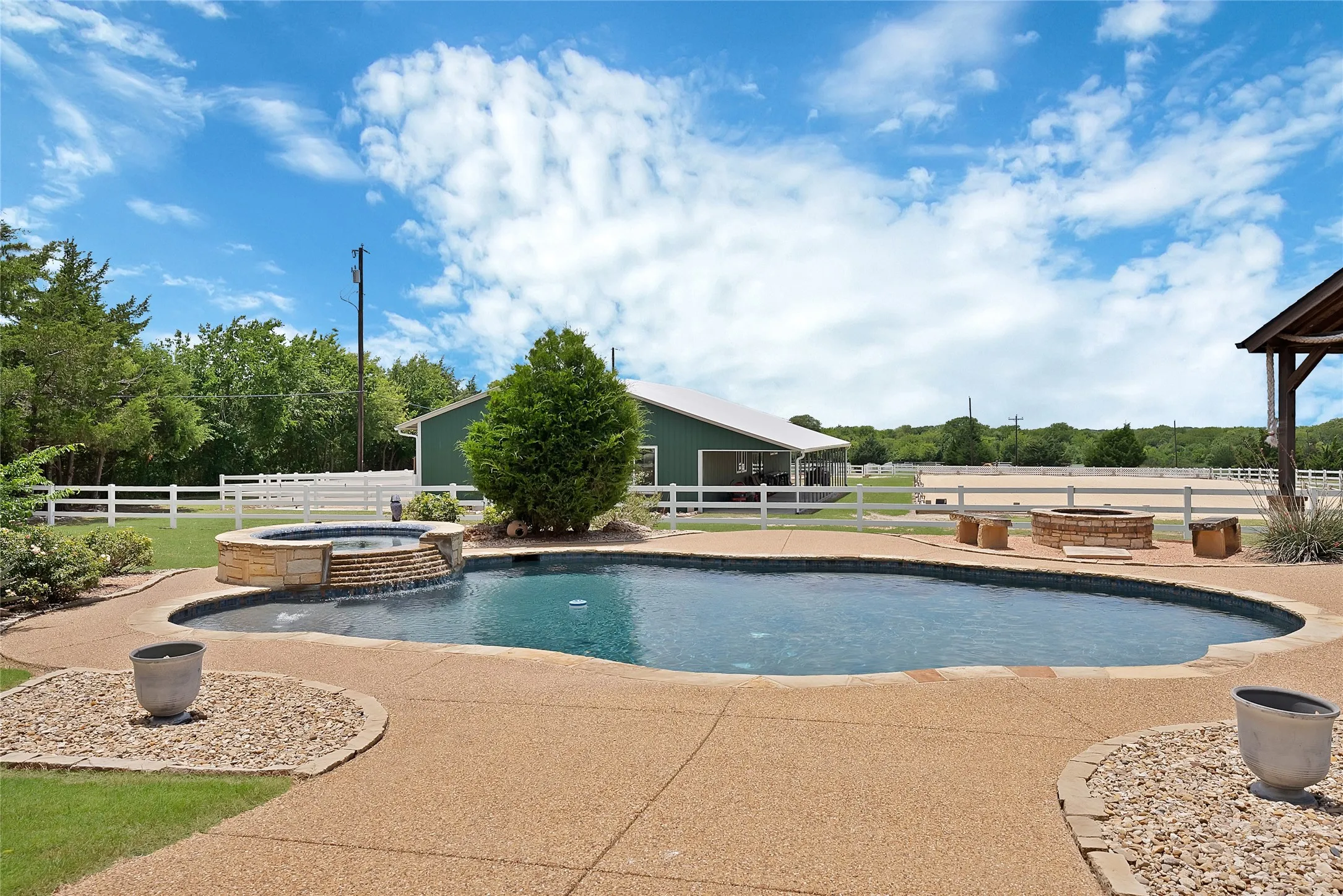 Heated pool and spa for year round use with tranquil water feature
